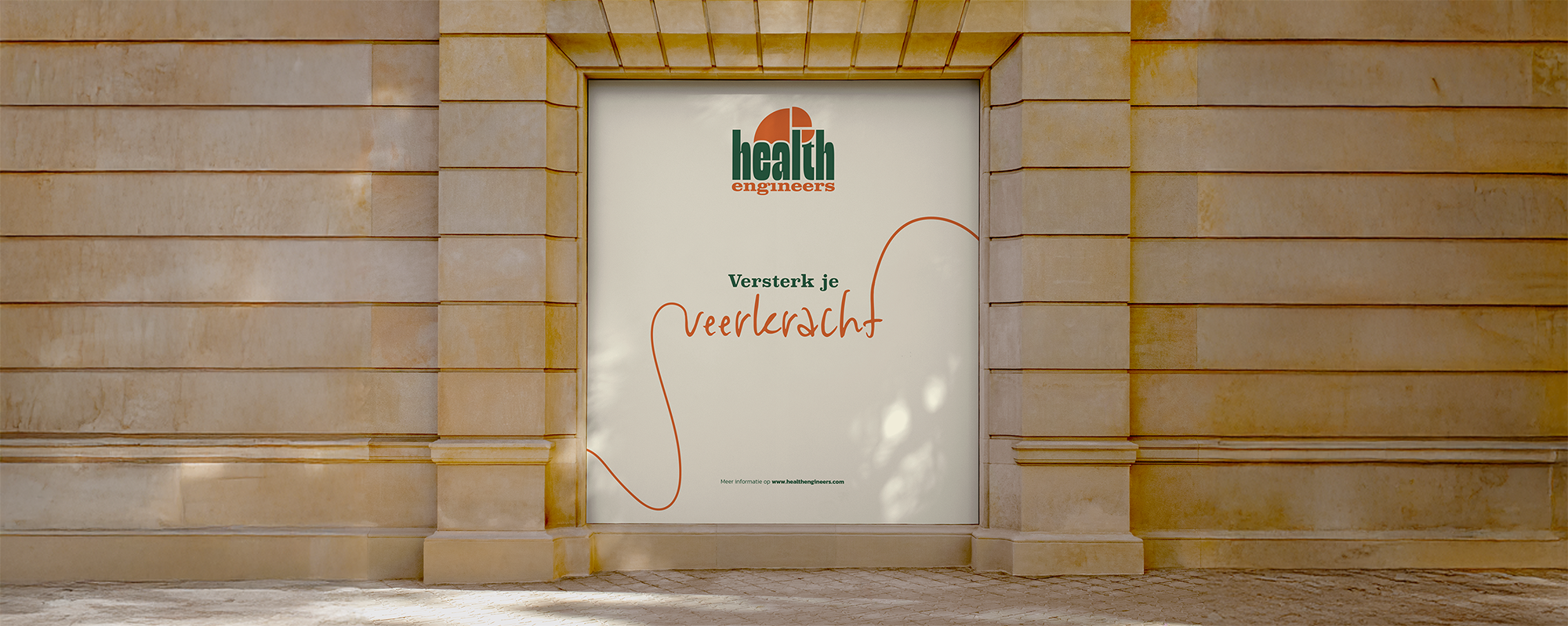 A large poster on a stone wall featuring the logo of 'health engineers' and a Dutch phrase about strengthening your voice.