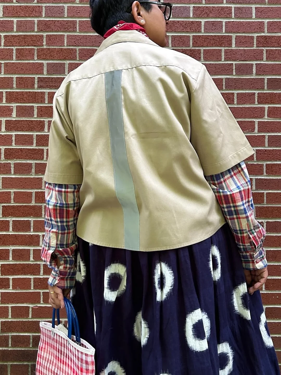 @sideways_toupee looks experly styled this North Star piece, an upcycled from a Navy uniform. I added gingham pockets, a subtle homage and reworking of the American flag&rsquo;s stripes, and a reflective strip down the back, a visual nod to the visib