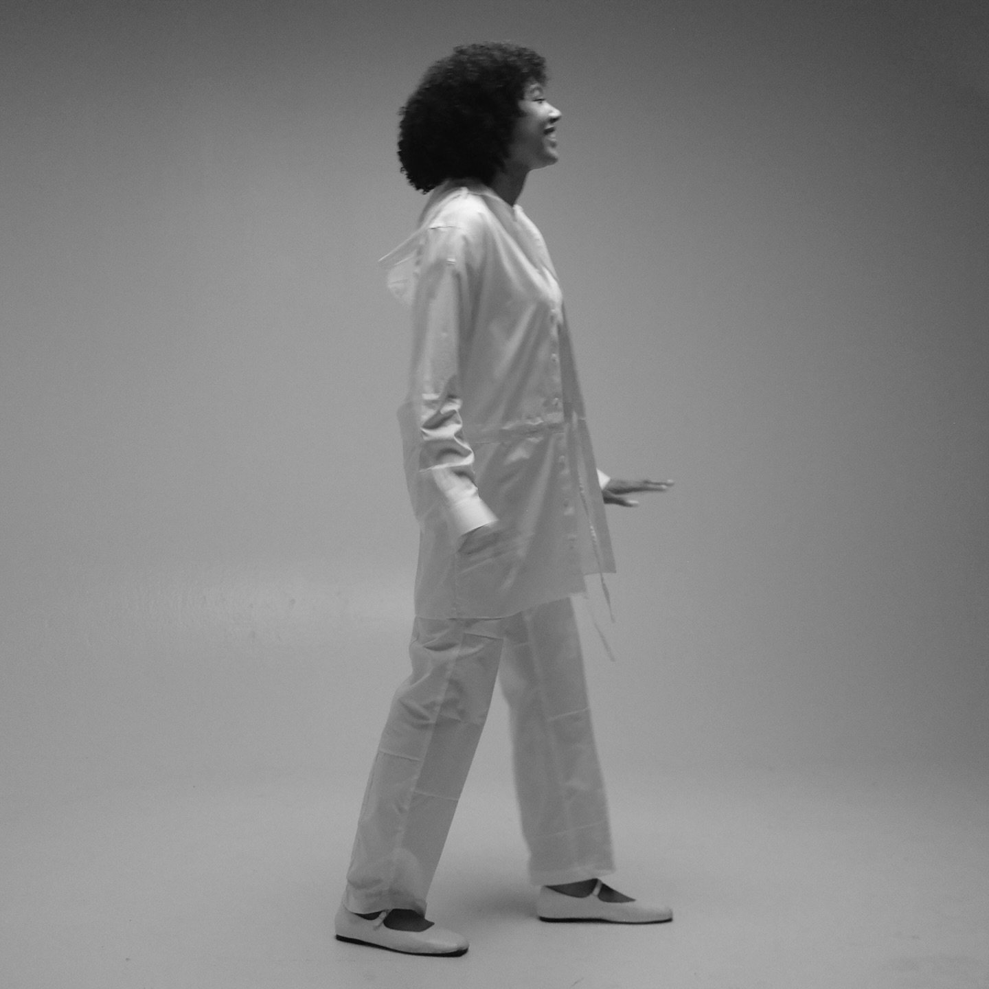 Lauryn in trousers and a hooded duster made entirely from upcycled Brooks Brothers shirting