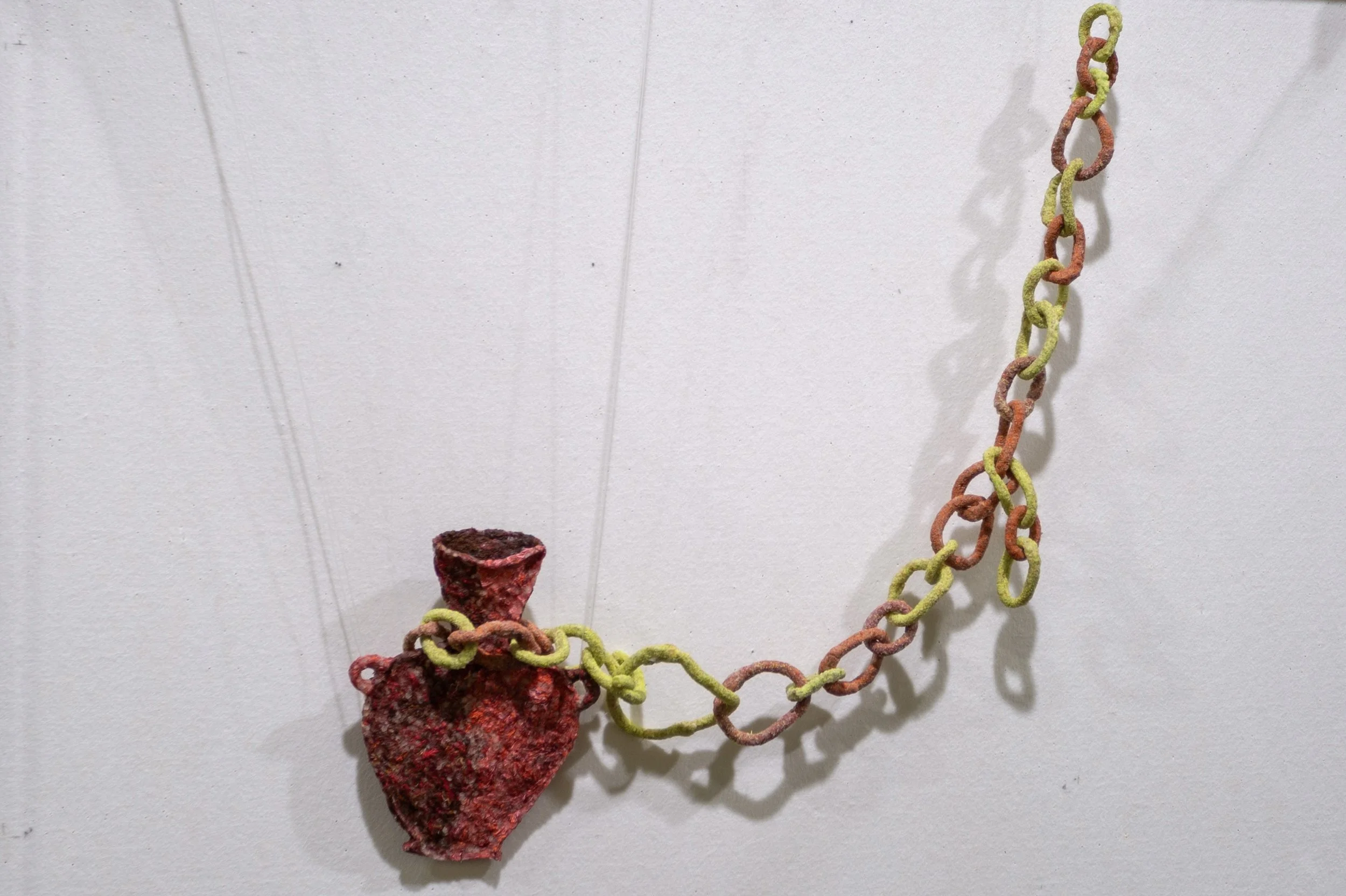 Breathe, Vivian Qiu, 2024, rice, embroidery floss, sand.