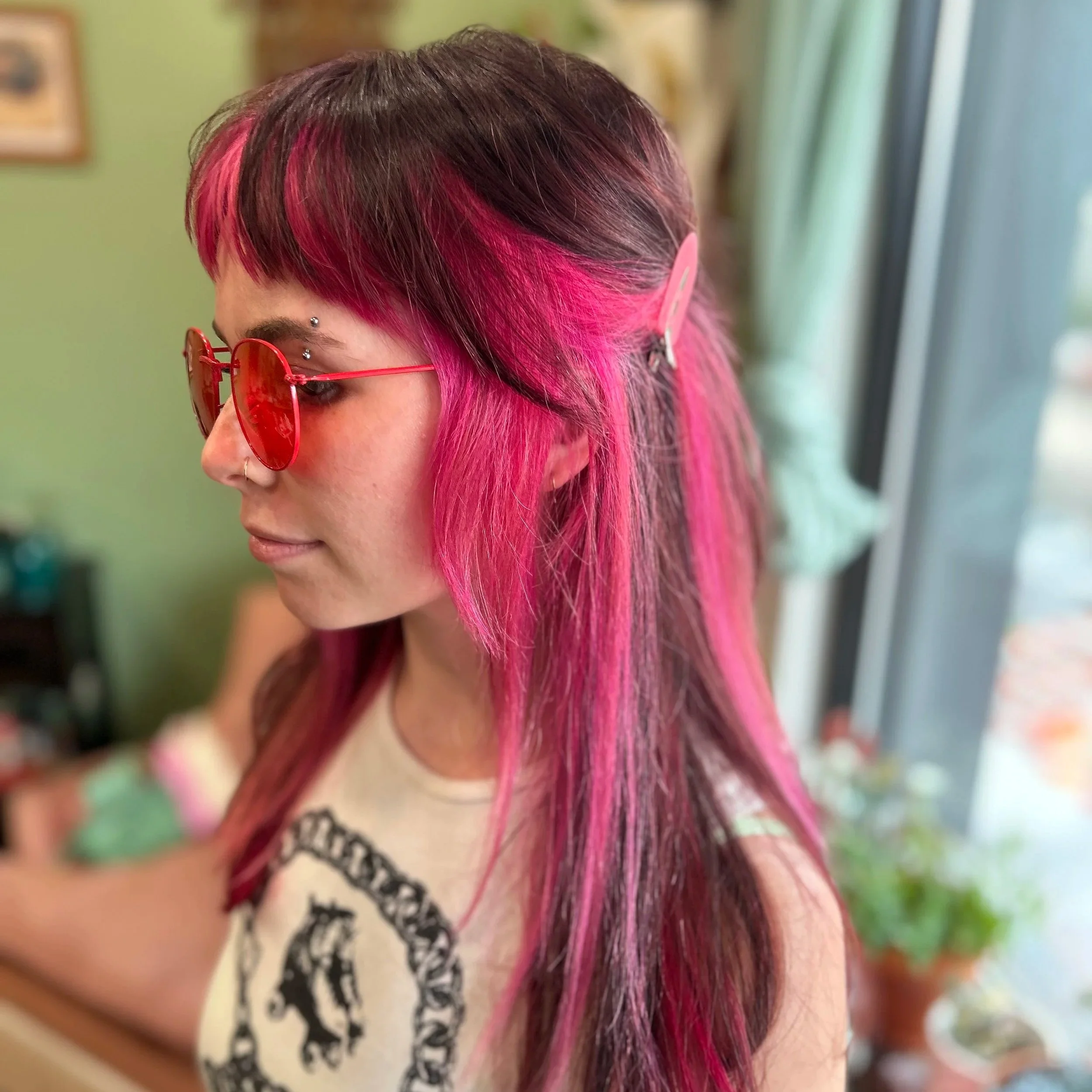pink hair long hair with bangs short bangs pink colorblock hair minneapolis hairstylist