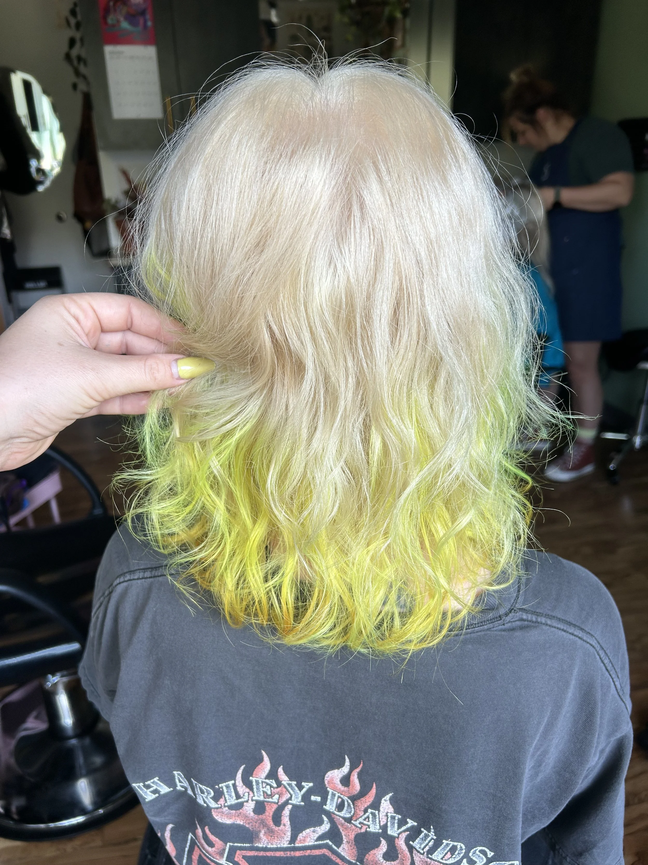 bleach and tone platinum blonde neon hair blonde hair white hair butter blonde dip dye minneapolis hairstylist razor cut 