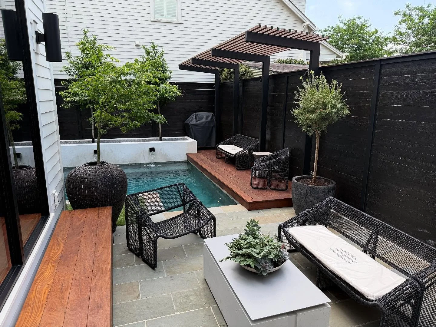 Who says small spaces can&rsquo;t make a big splash?  This cozy backyard proves that with a thoughtful design, you can turn even the smallest space into a private oasis. From the sleek plunge pool to lush greenery and stylish stonework &mdash; every 