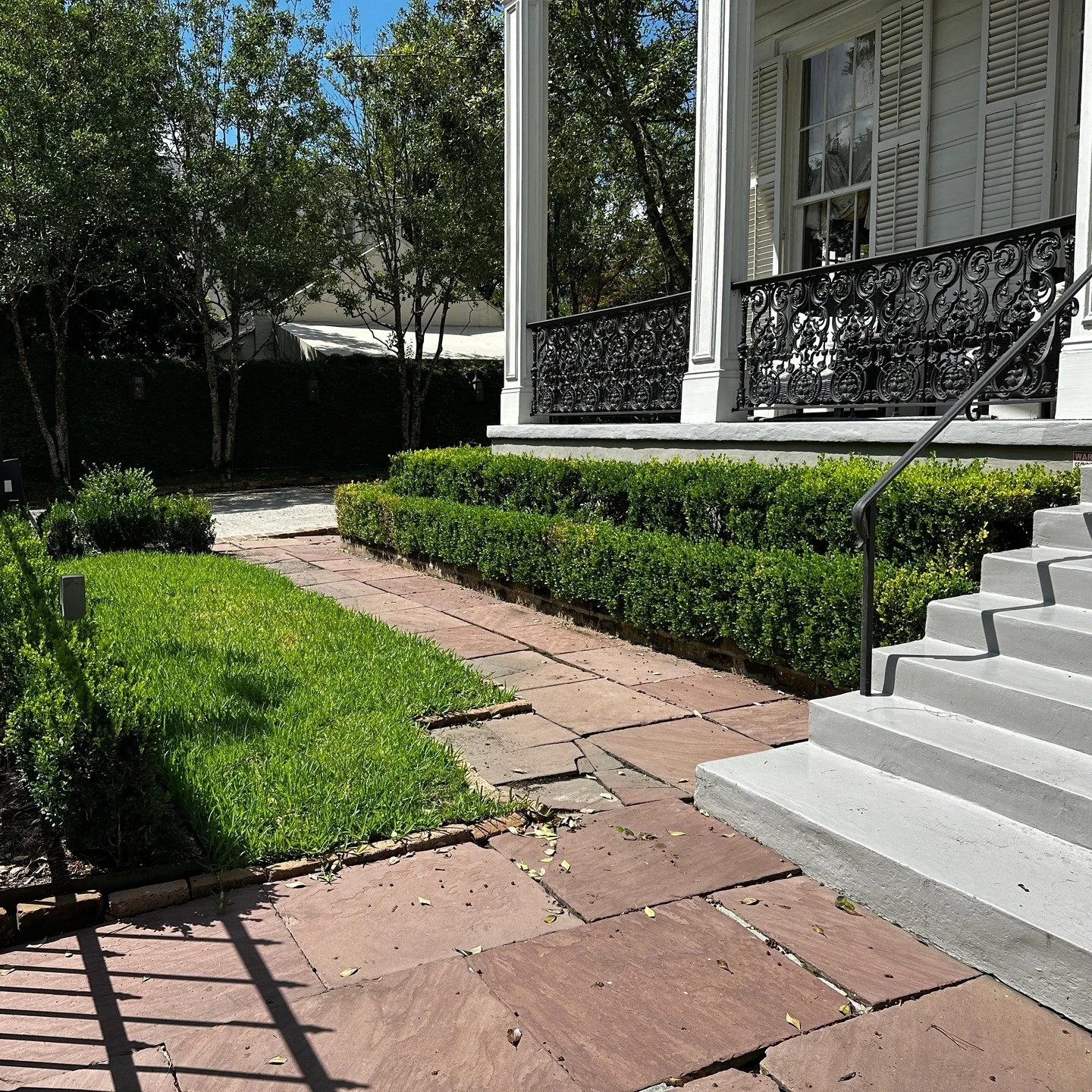At this garden district property we kept the history while refreshing the look. This path is being built reusing the original stone. Old charm, new life.