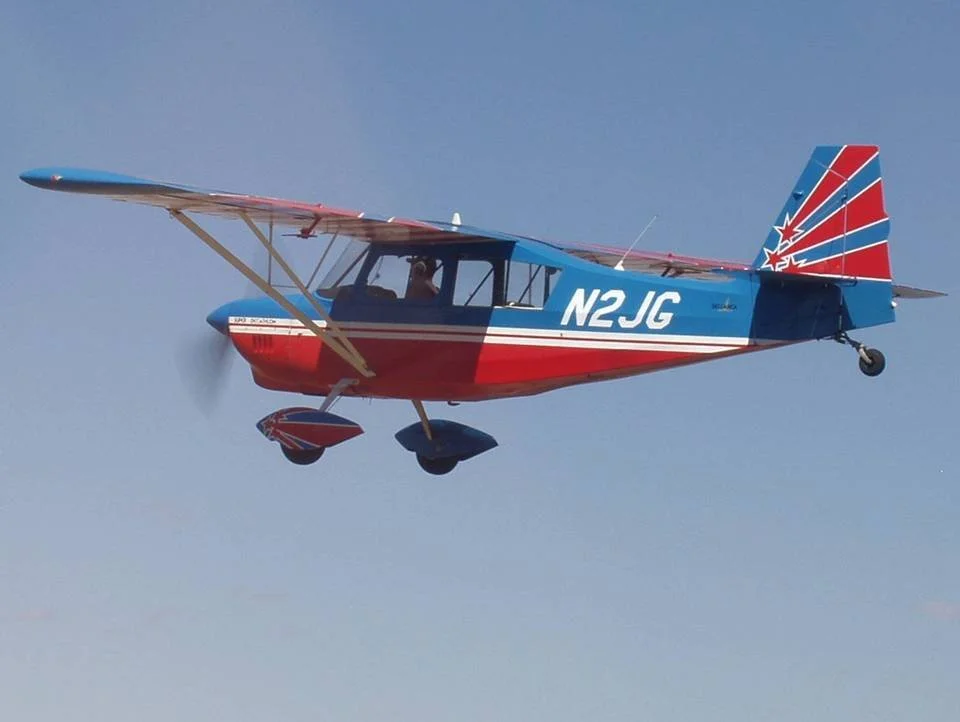Wetsu Aviation Super Decathlon N2JG tail with star and stripe design in flight