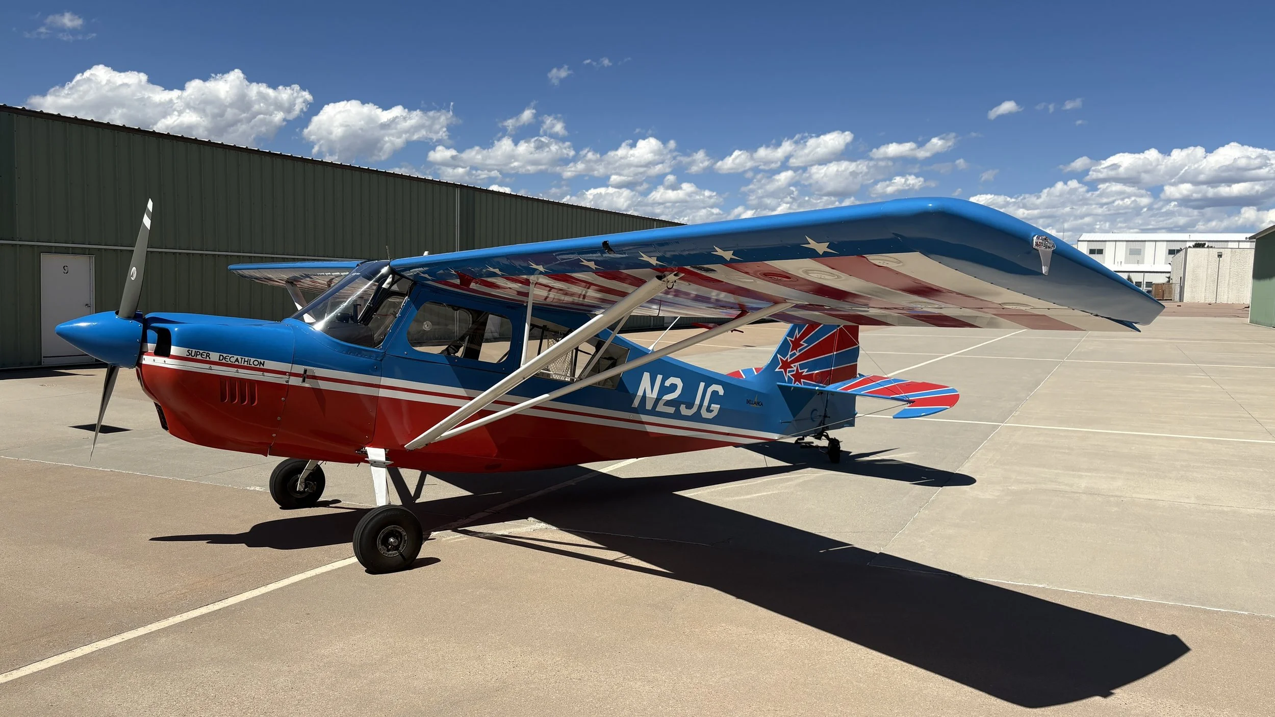 Super Decathlon N2JG tail with star and stripe design at WETSU Aviation hangar