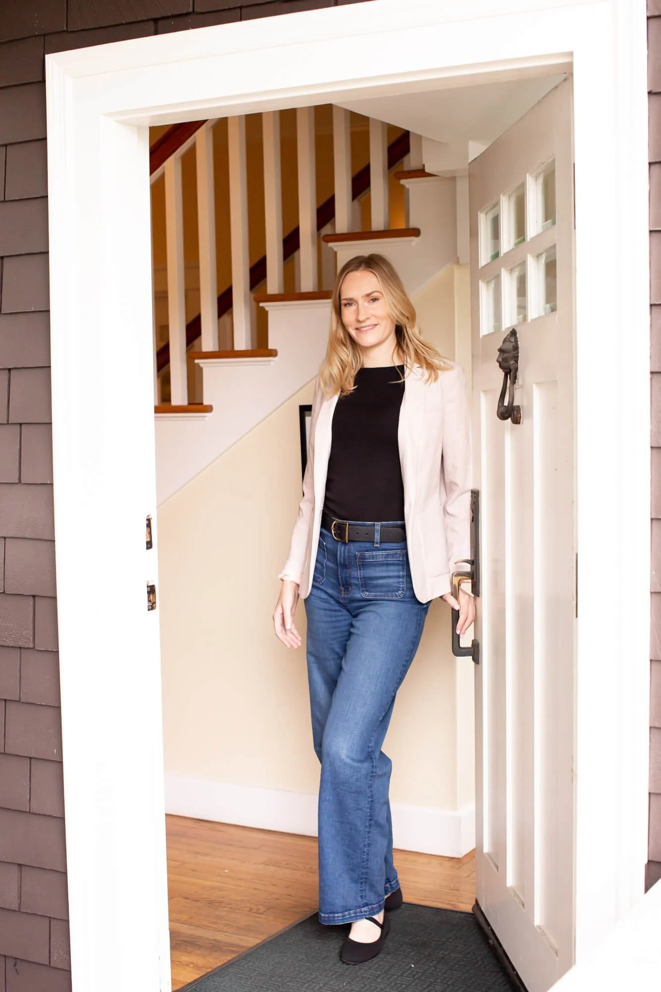 Angela Sitka, licensed therapist opening the door to her private practice office in Santa Rosa