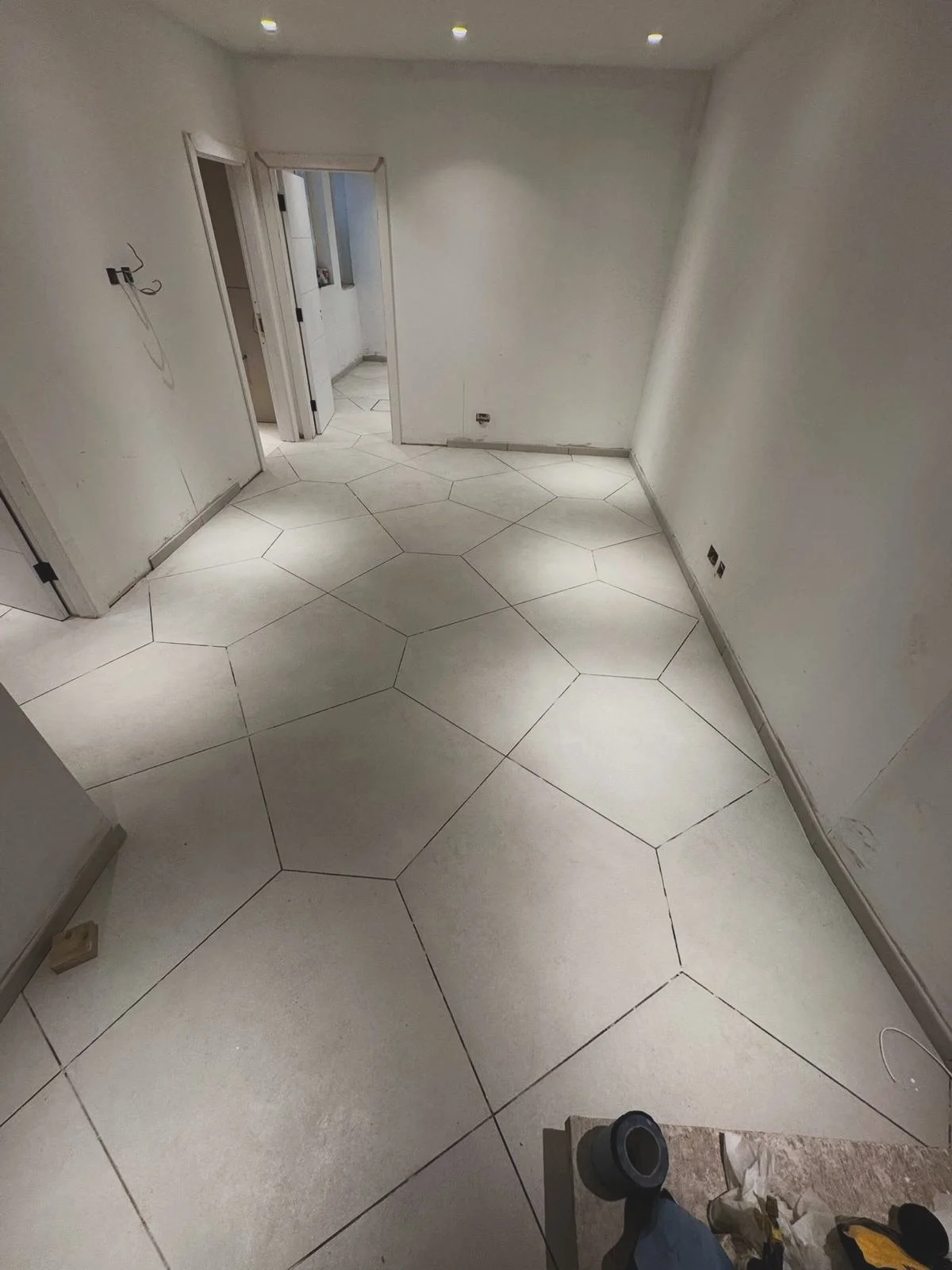 From prep to finish &mdash; installing these beautiful porcelain tiles for our project in SW10

#londonconstruction #interiordecor #luxuryhomes #basementrenovation #construction