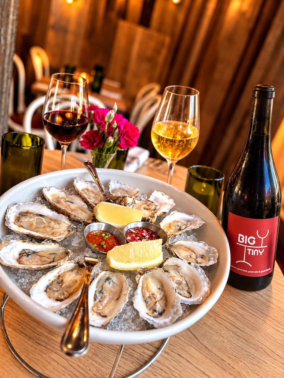 Oysters on ice with Big Tiny house wine, red and white glasses