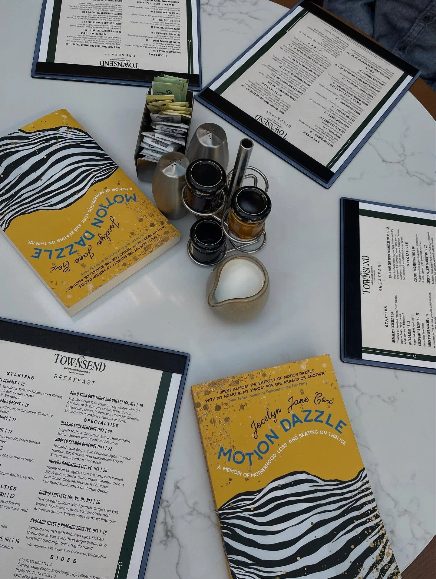 This is how the table looked when we arrived for breakfast in CT this weekend with Nancy and Richard (who are in the book!). I <of course> signed their copies of Motion Dazzle 🖊️ and <of course> commended Nancy on her excellent stripes (