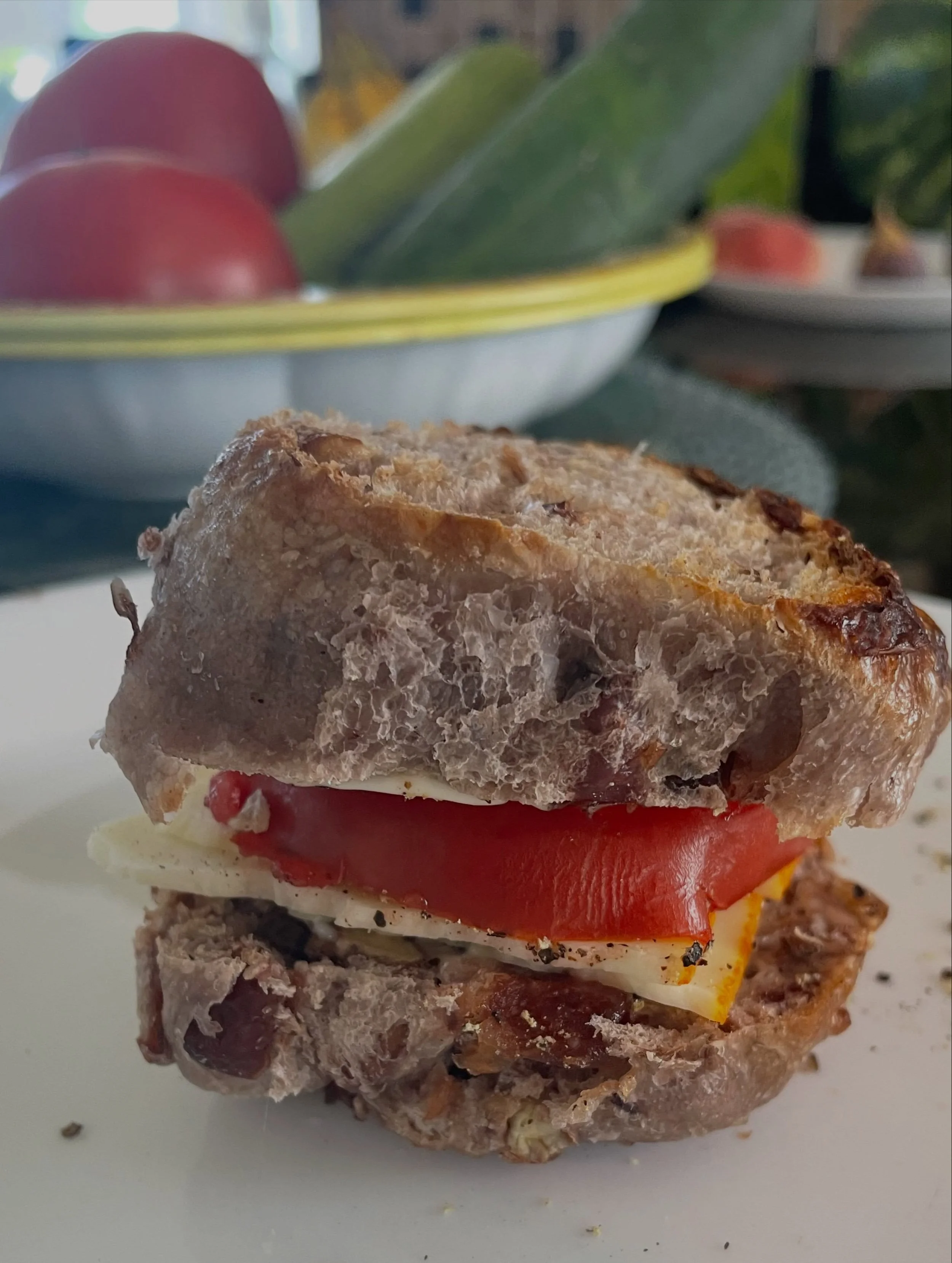 I write a lot about the sandwich generation, that caregiving squeeze so many of us experience. But this is an actual sandwich that my mom used to make in the summer ~ I made it yesterday in honor of her birthday. 

Fresh tomatoes (very fresh tomatoes