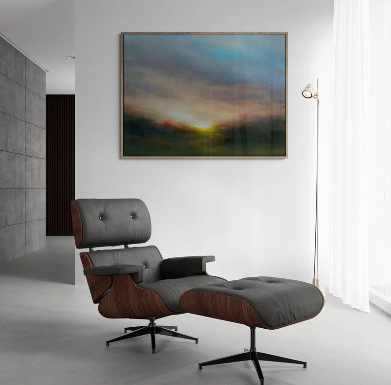 Impressionist sunrise painting hanging on wall above armchair and floor lamp