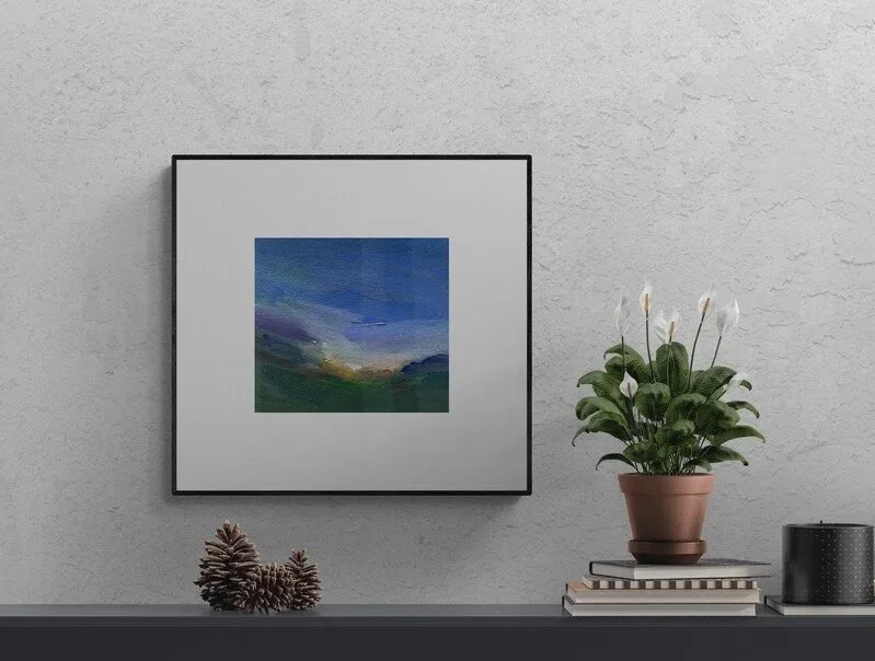 Twilight Tango small abstract sunset painting hanging above a bench with plant