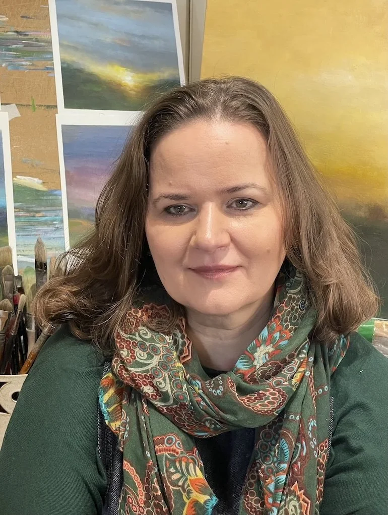 A studio hand and shoulders head shot of Mary Burtenshaw
