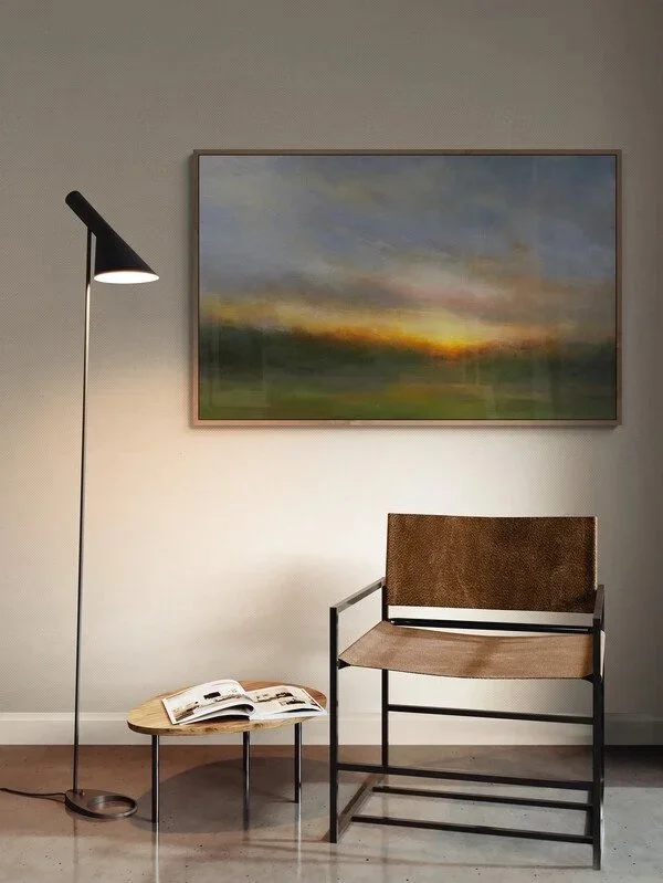 Impressionist painting Melancholy Sun hanging on wall above chair and floor lamp