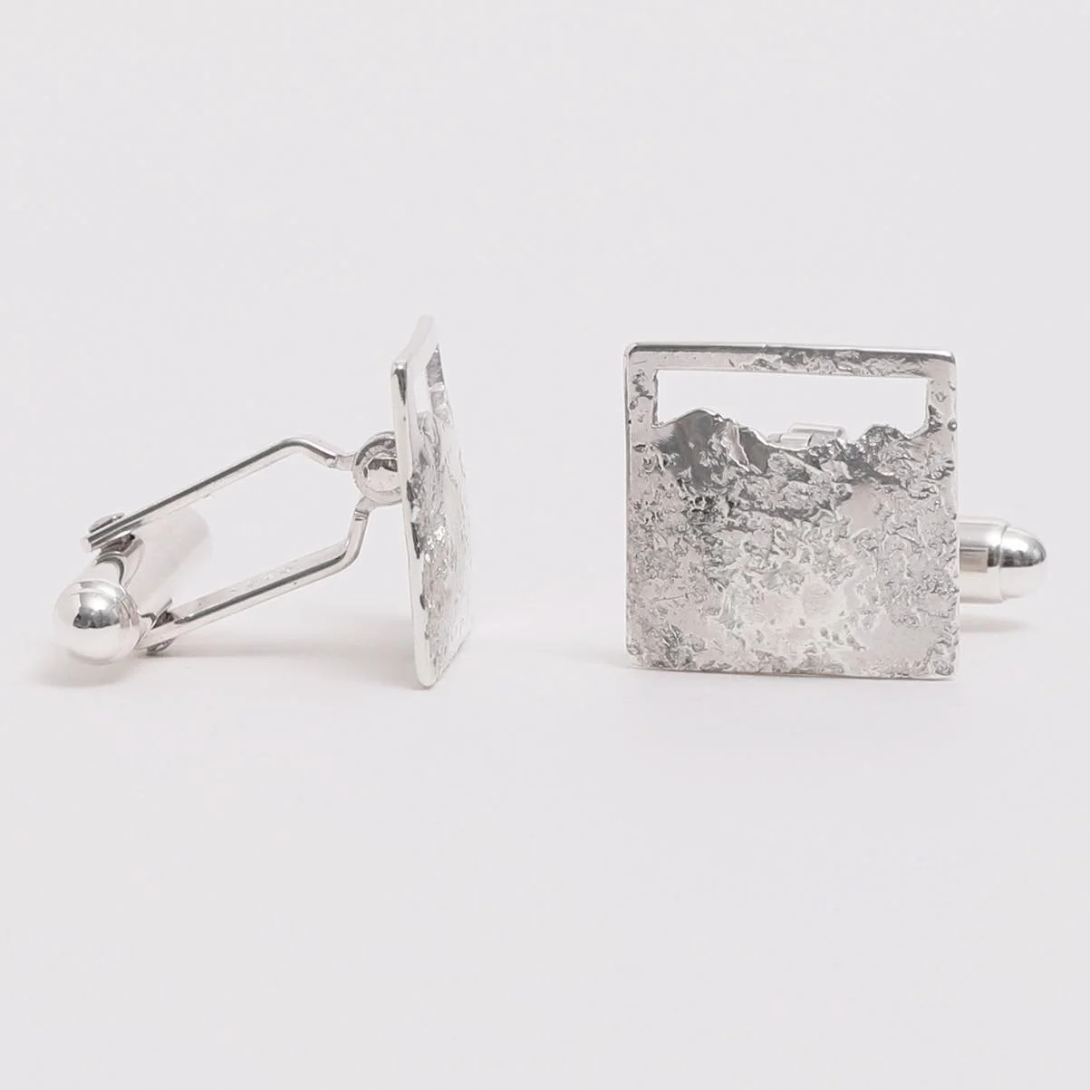 Part of the Mourne collection, these cufflinks are shaped to show the exact outline of the Mourne Mountains in County Down, showcasing the silhouette of Slieve Donard, the Saddle and Slieve Commedagh. The metal has been textured with Mourne granite,