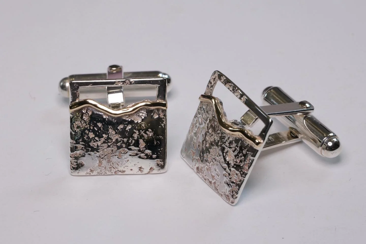 Part of the Mourne collection, these cufflinks are shaped to show the exact outline of the Mourne Mountains in County Down, showcasing the silhouette of Slieve Donard, the Saddle and Slieve Commedagh.
The metal has been textured with Mourne granite,