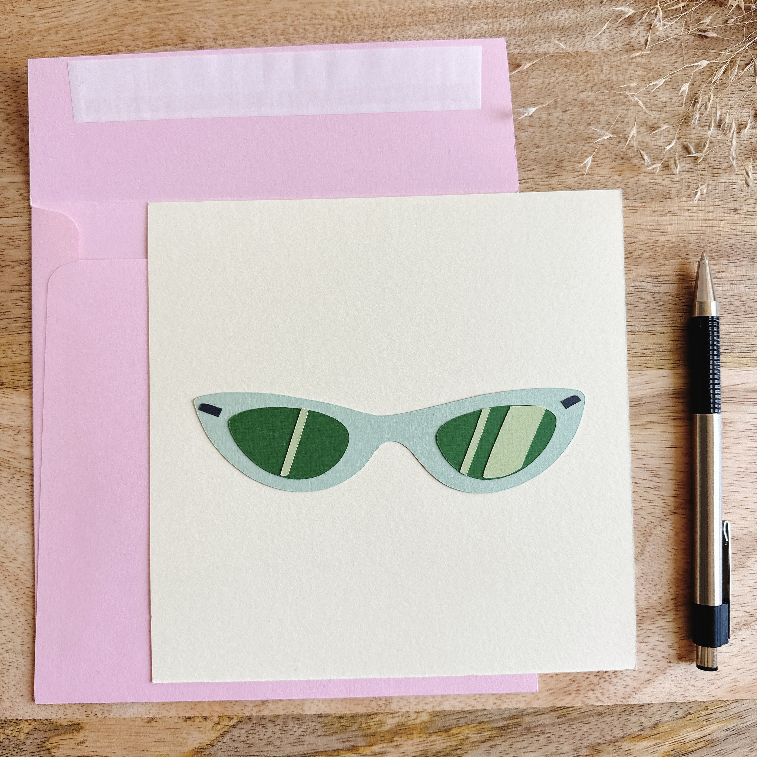 Papercut collage Cat Eyes — 6x6 inch artwork of green cat-eye sunglasses, symbolizing style and attitude.