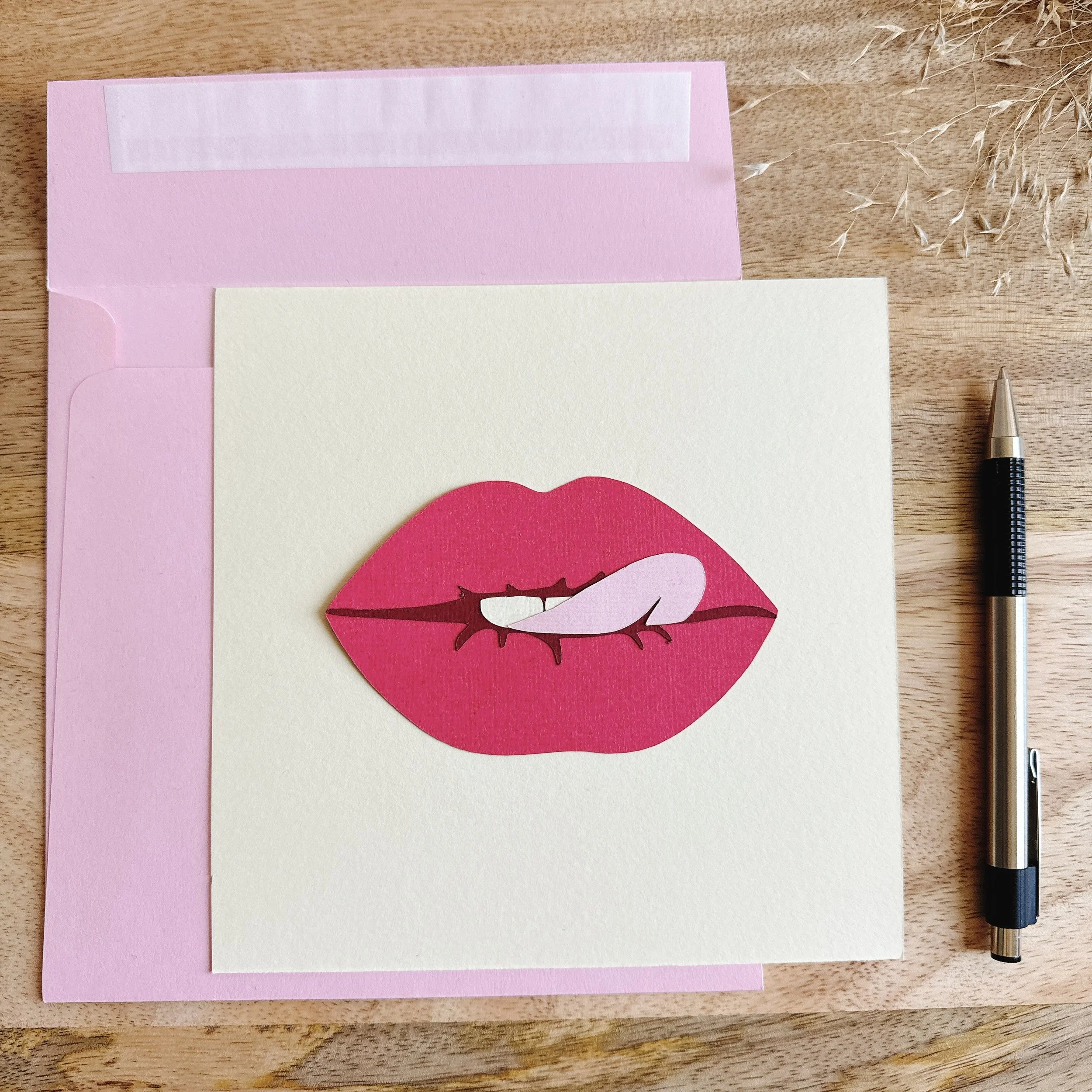 Papercut collage Kiss Me Quick — 6x6 inch artwork of pink lips biting playfully, inspired by pop art.