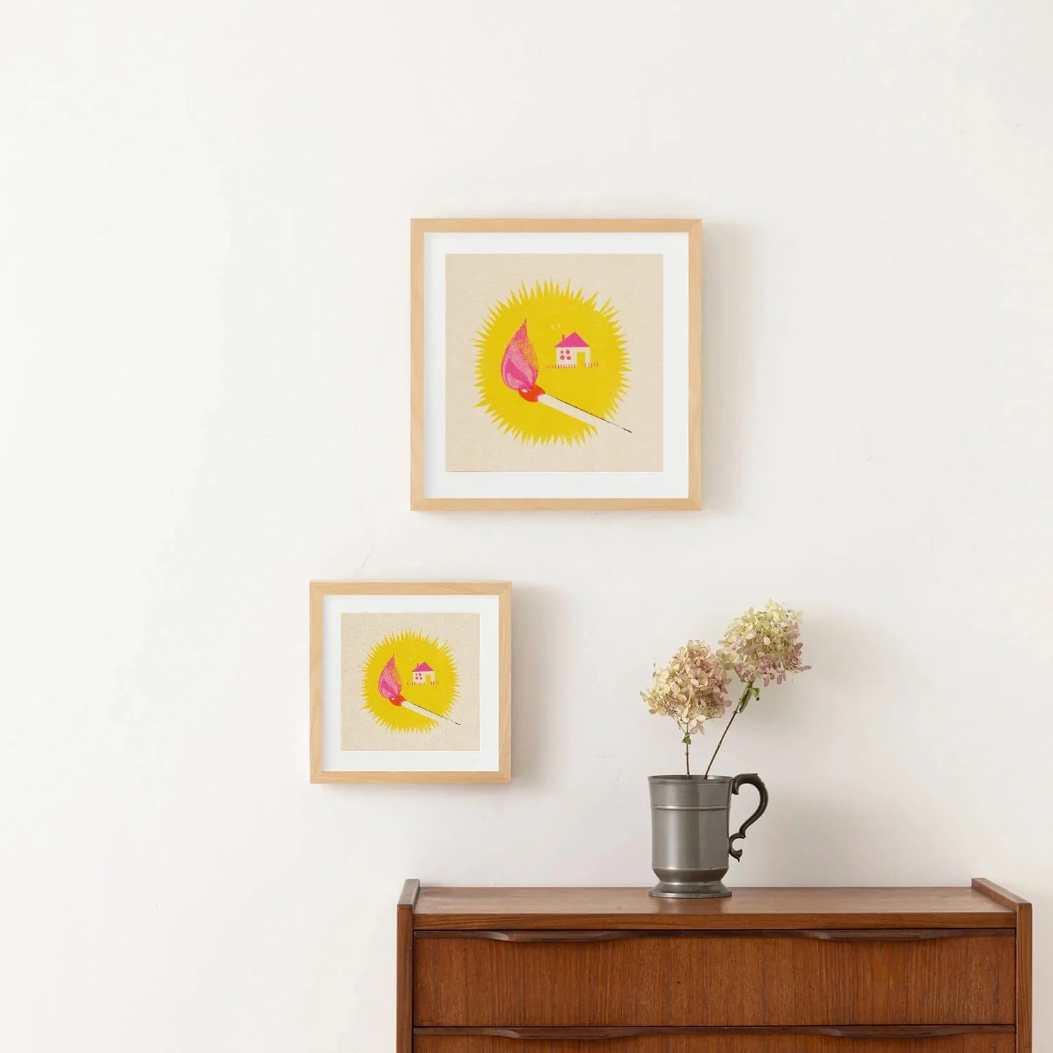 Framed Home Spark art print featuring a colorful burning match, pink flame and tiny house in a playful minimalist illustration.