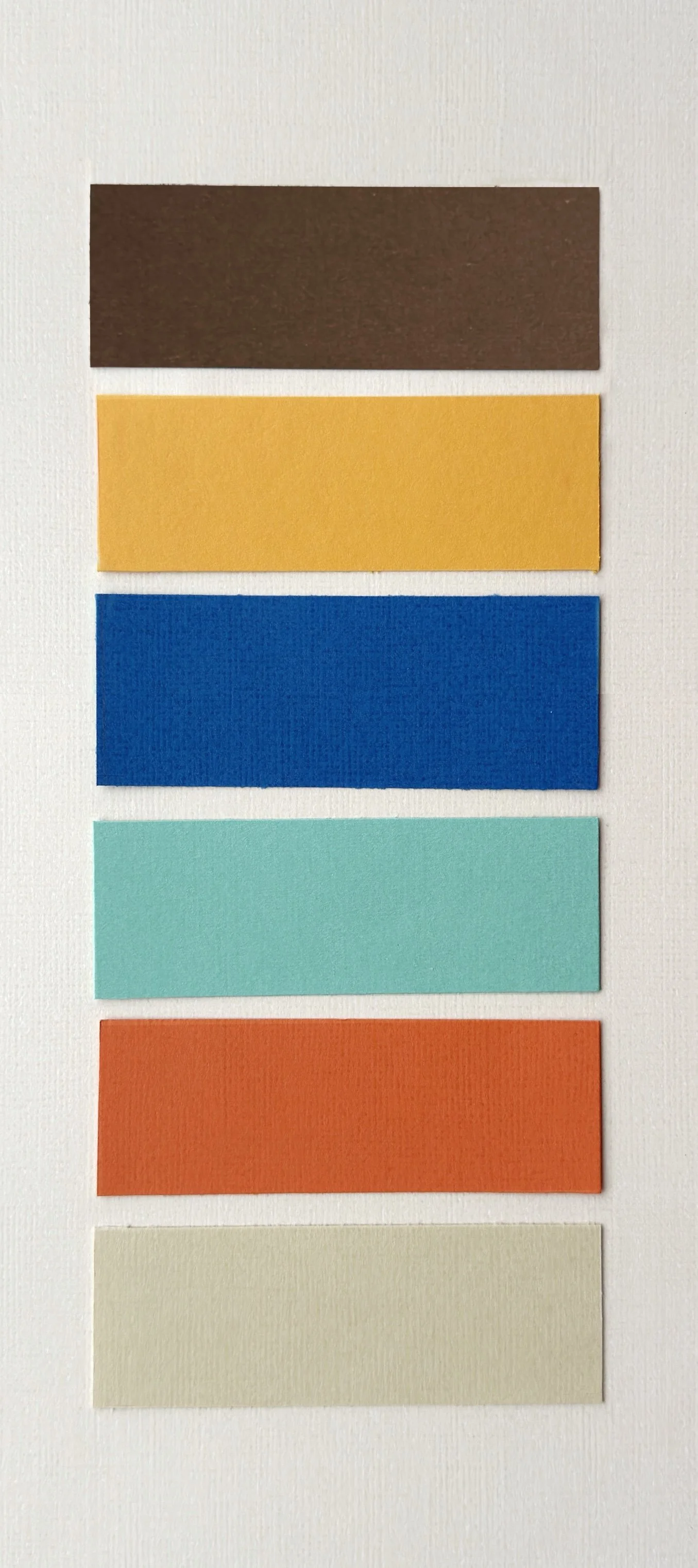 Hand-cut paper collage artwork by contemporary paper artist, featuring minimalist compositions made from layered colored paper