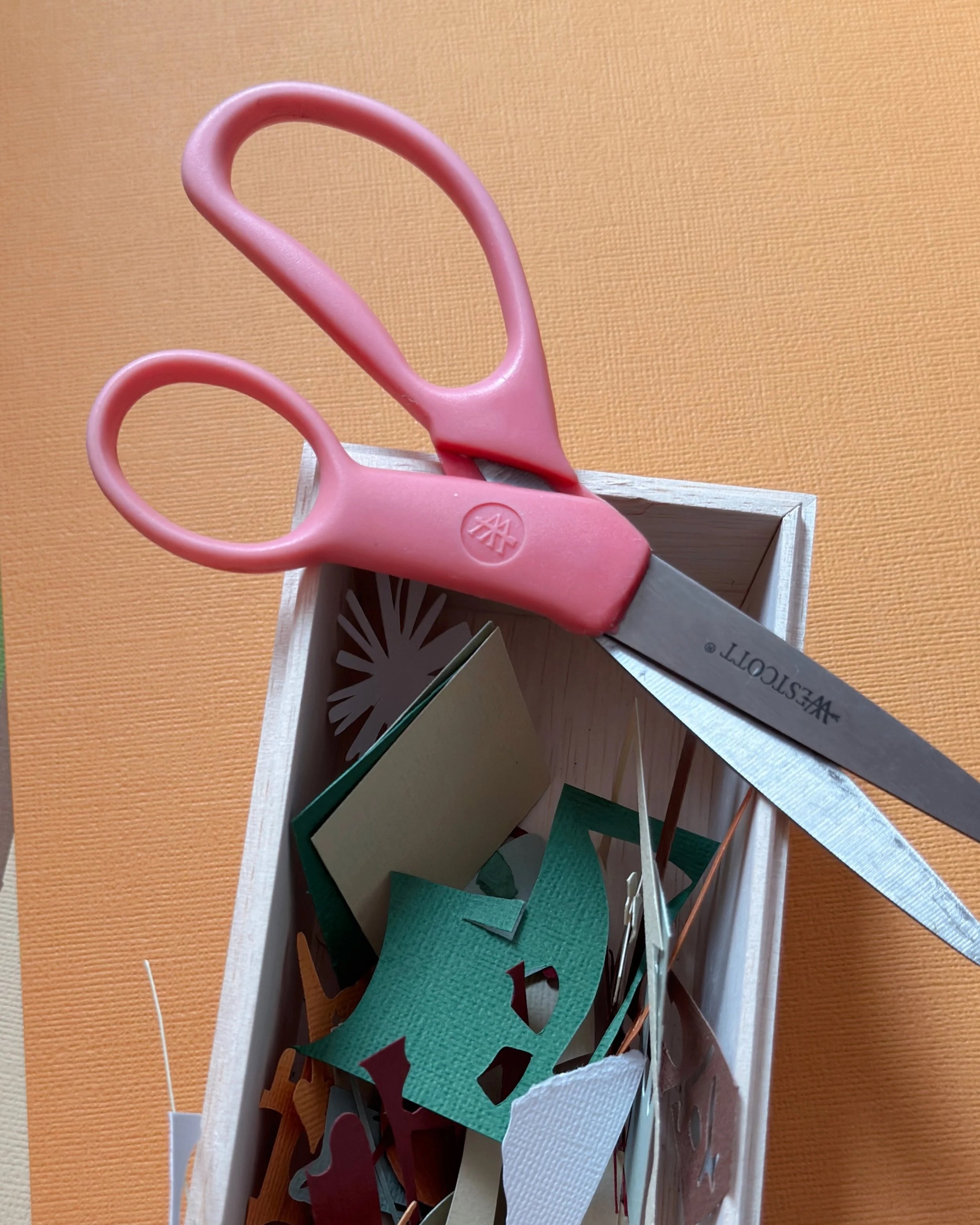 Hand-cut paper collage of [subject/character], layered paper textures, soft color palette, created by Veronika Timokhina.