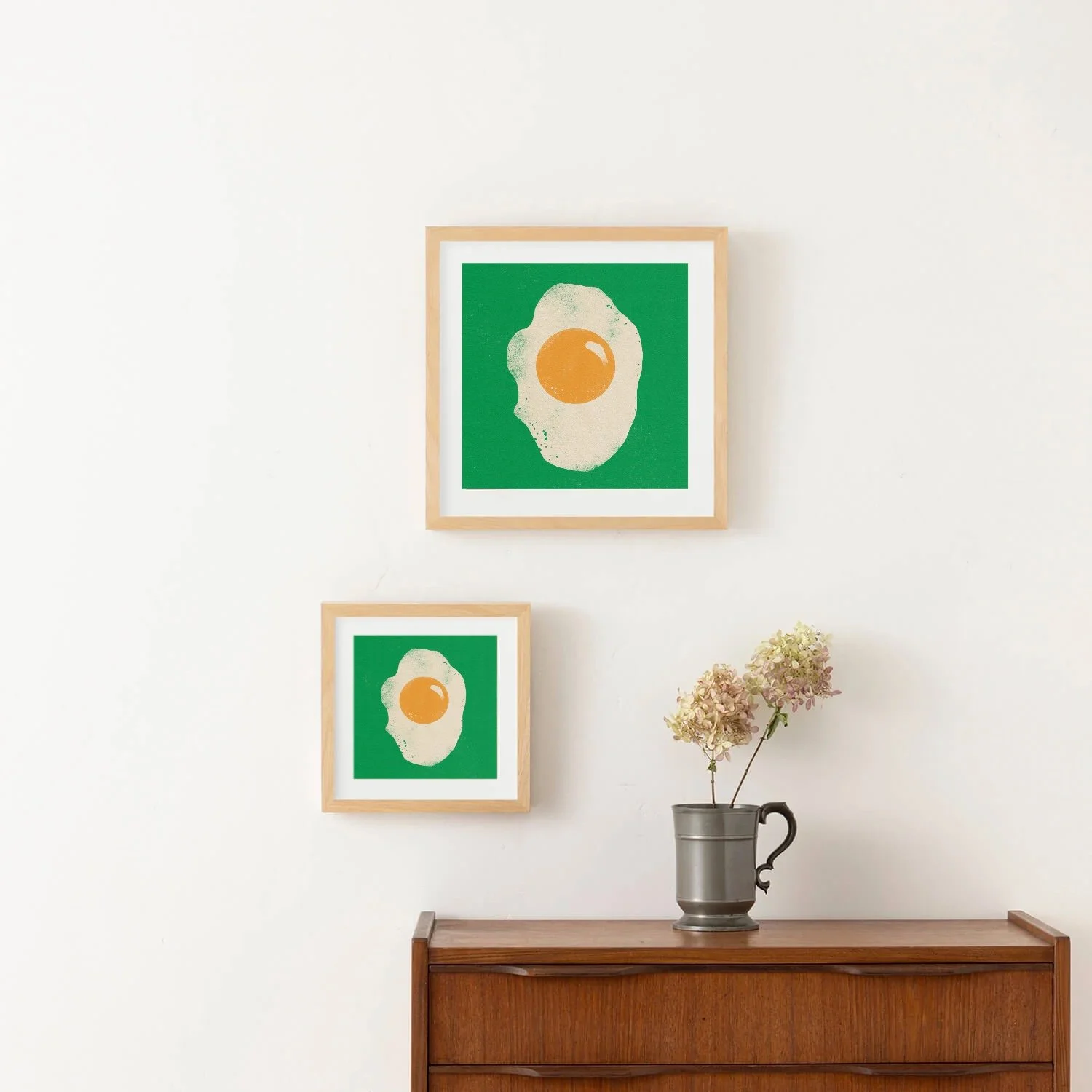 Minimalist illustration of a fried egg with a bright yellow yolk on a green background in interior