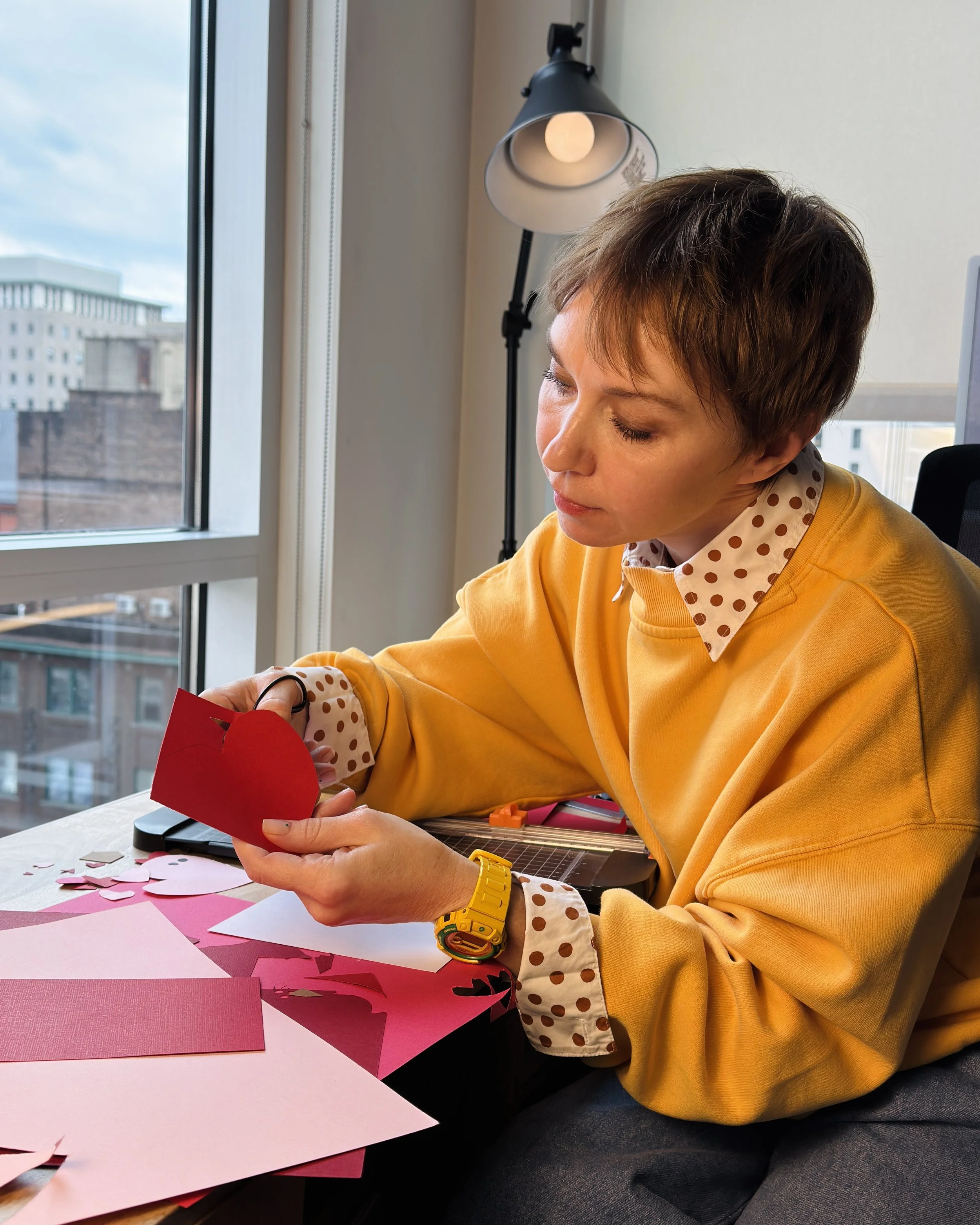 Hand-cut paper collage artwork by contemporary paper artist, featuring minimalist compositions made from layered colored paper