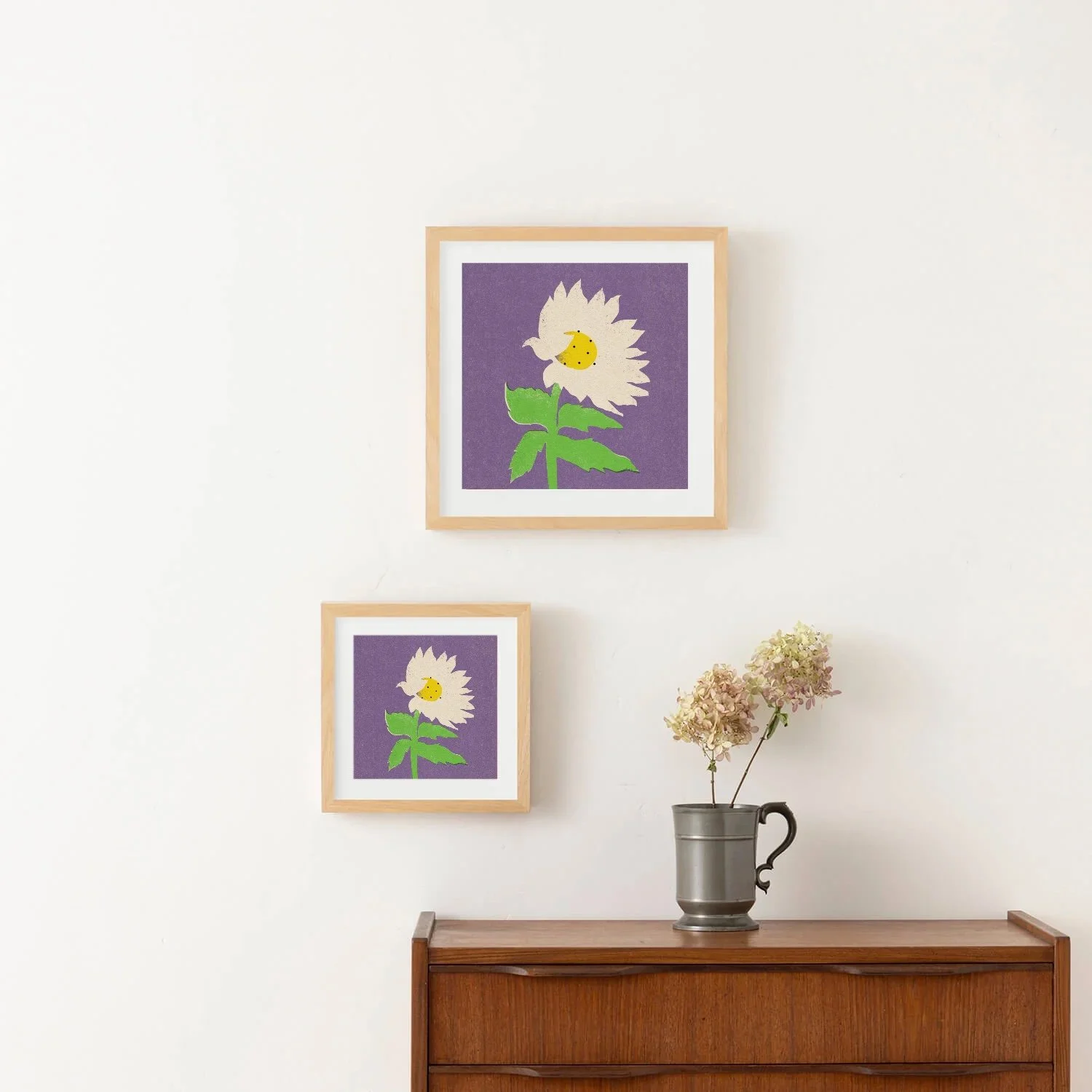 Framed Happy Flower art print featuring a playful white flower with a smiling yellow center and bright green leaves on a purple background.