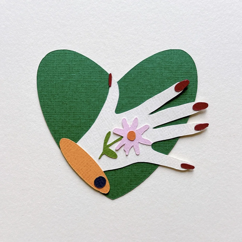 Heart and hand papercut collage