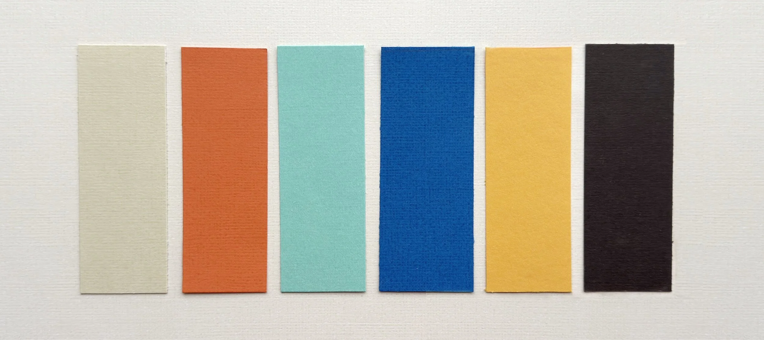 Hand-cut paper collage artwork by contemporary paper artist, featuring minimalist compositions made from layered colored paper