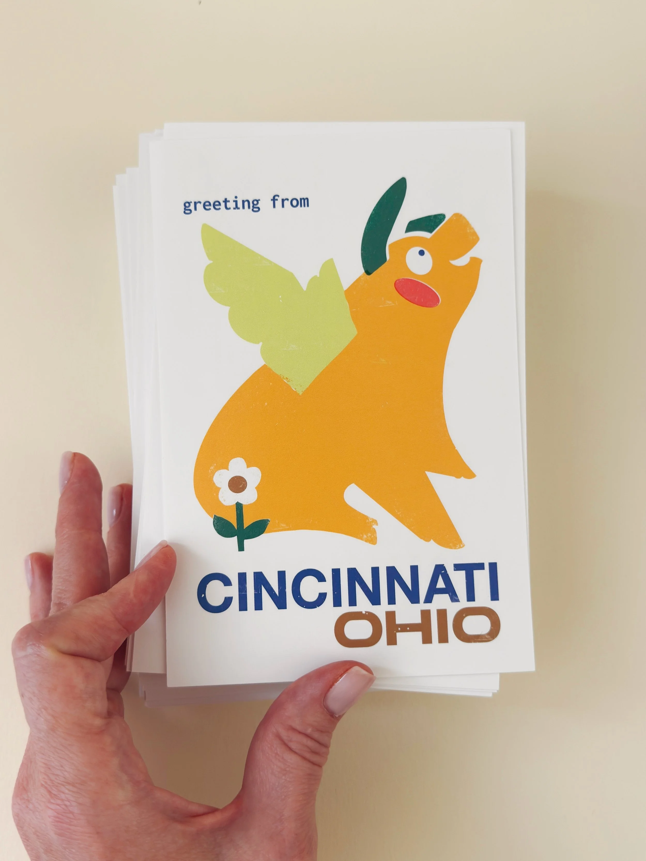 Flying Pig Cincinnati greeting card with kraft envelope on a beige background