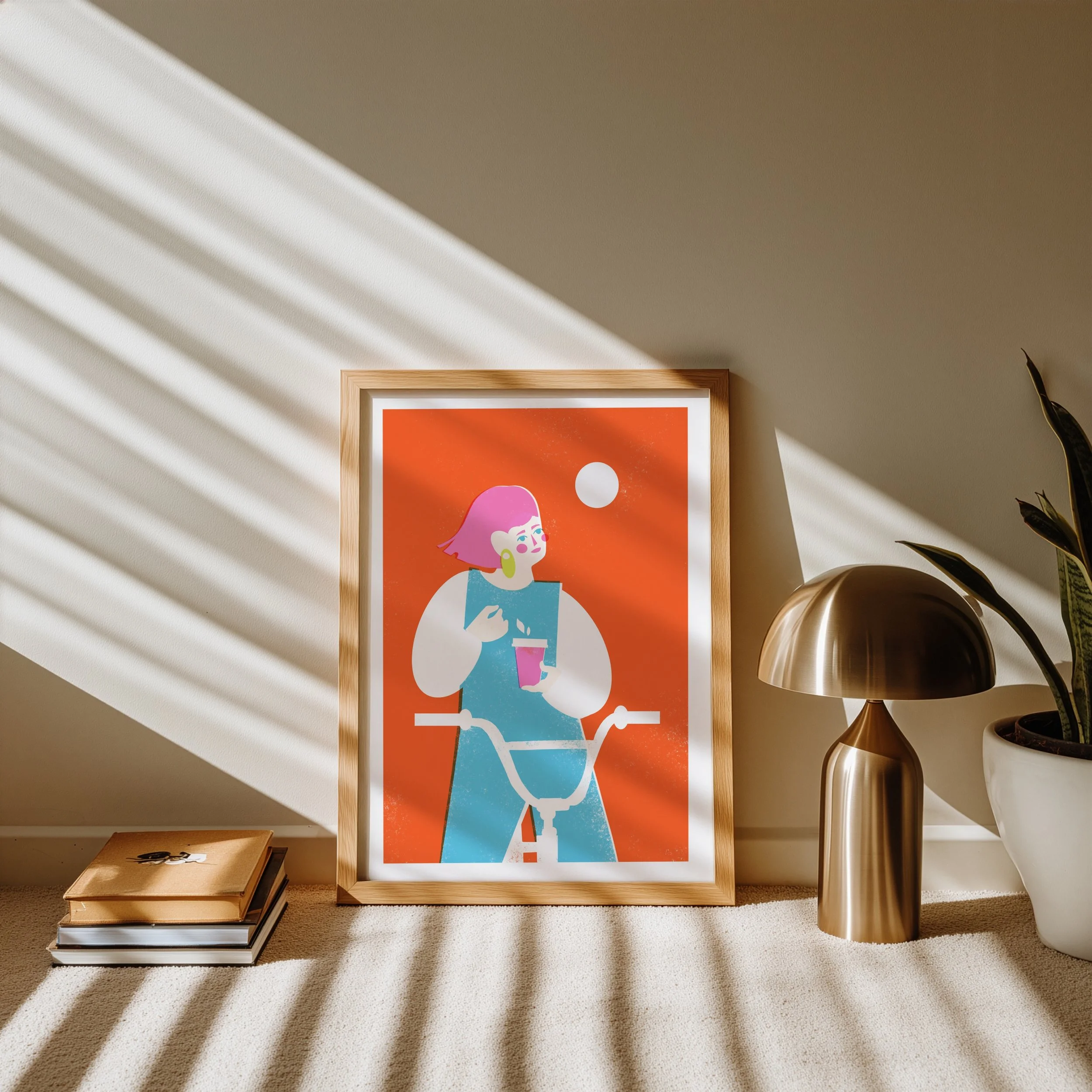 Modern illustration of a girl with pink hair holding a coffee cup next to a bicycle, set in a light oak frame against a neutral wall.