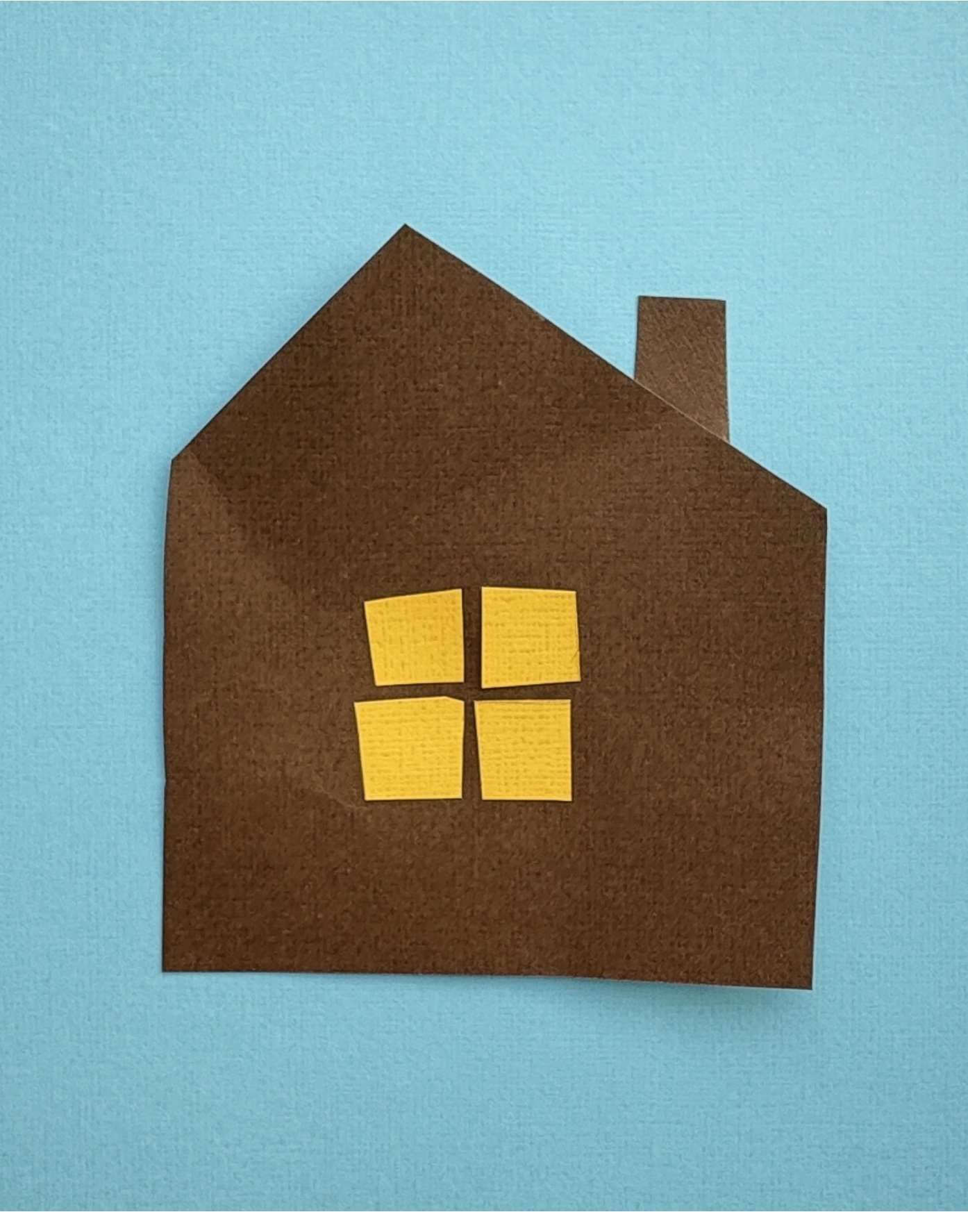 Hand-cut paper collage artwork by contemporary paper artist, featuring minimalist compositions made from layered colored paper