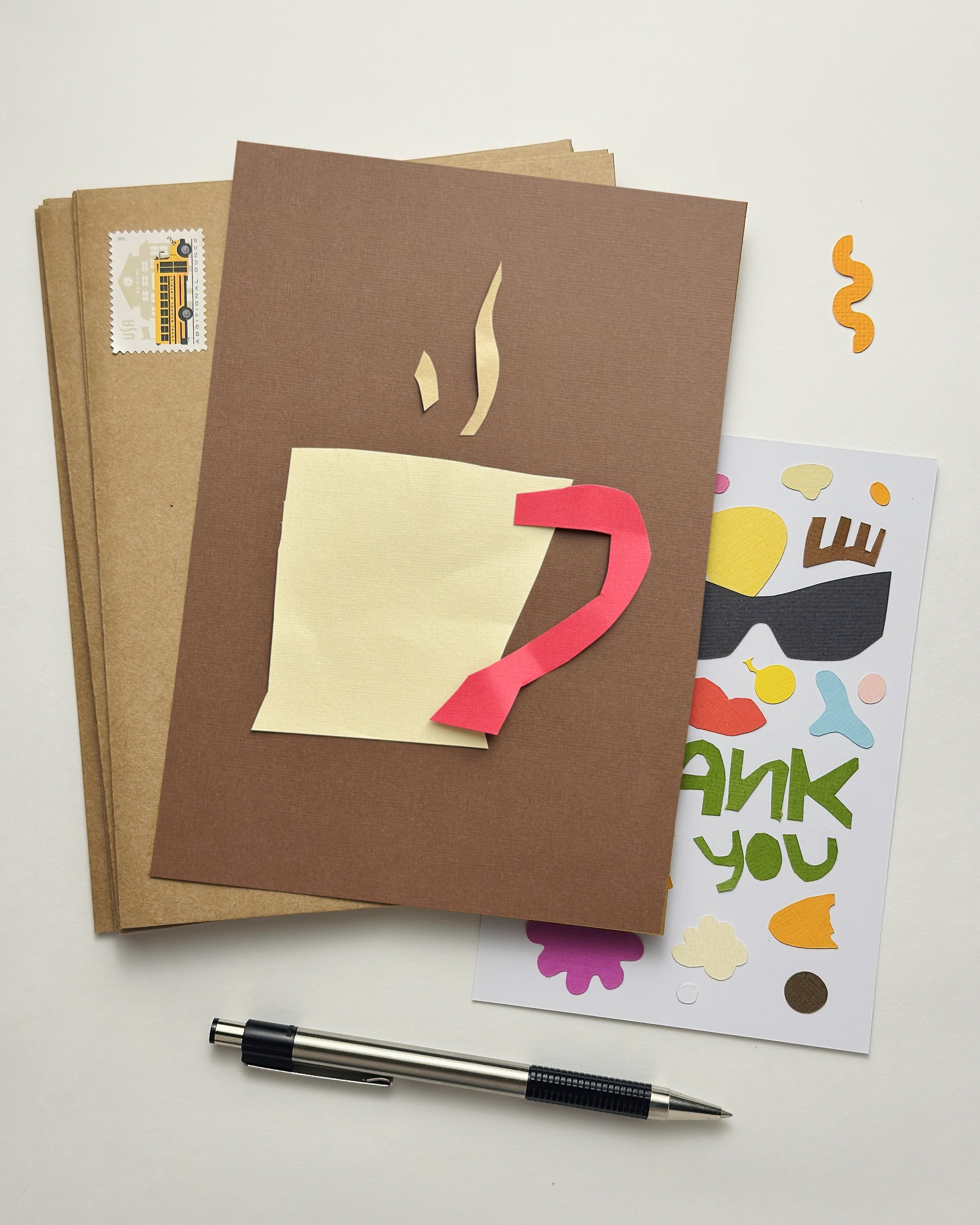 Hand-cut paper collage of morning drink, made from simple geometric shapes, photographed on a dark background, minimalist contemporary paper art