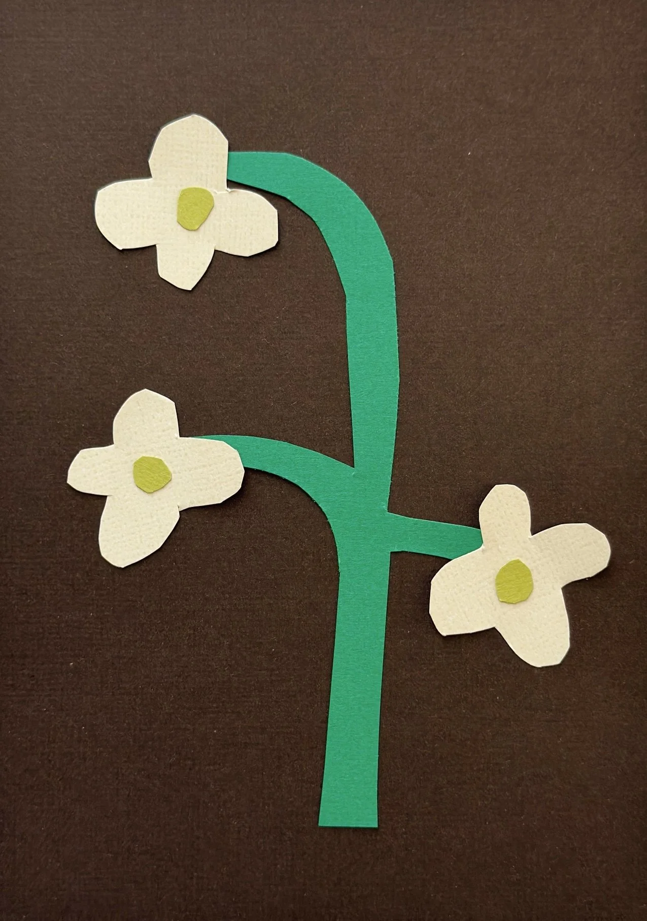 Hand-cut paper collage artwork by contemporary paper artist, featuring minimalist compositions made from layered colored paper