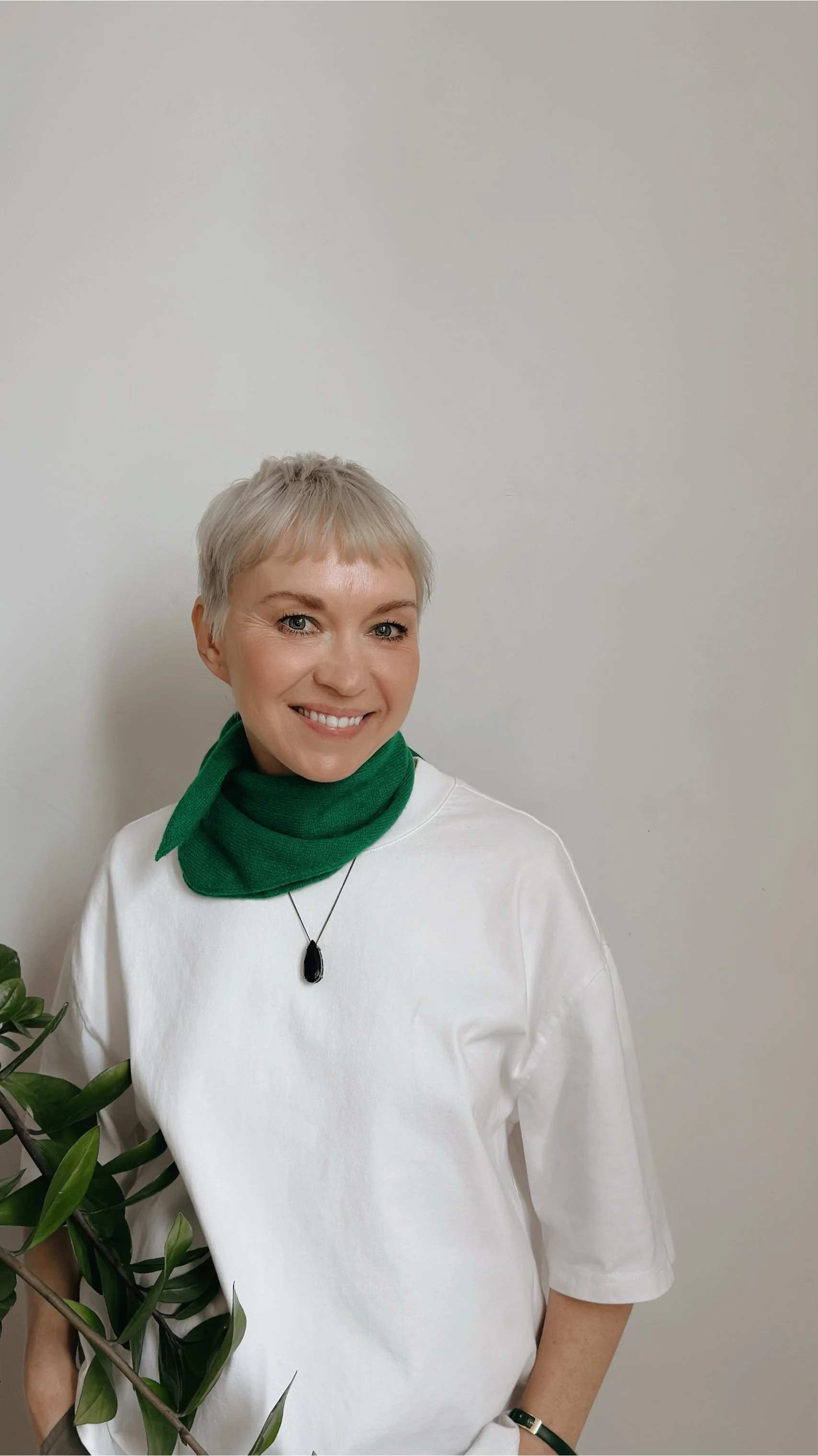 Artist Veronika Timokhina hand-cutting paper details with a precision blade scissors in her studio.