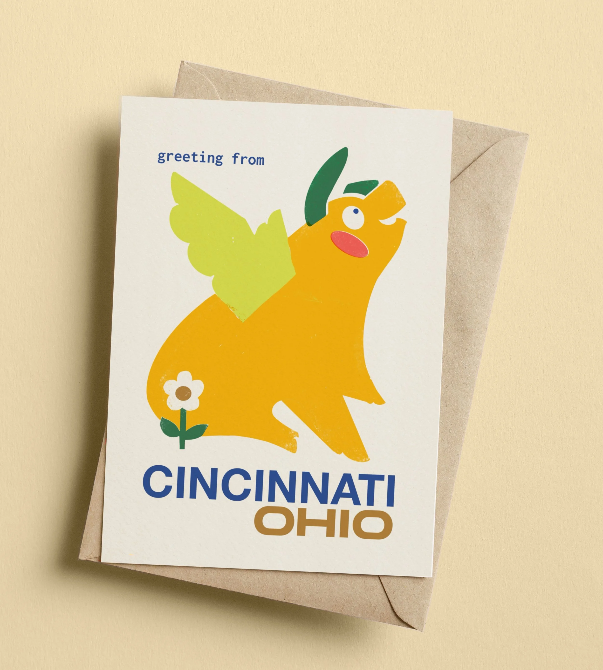 Flying Pig Cincinnati greeting card with kraft envelope on a beige background