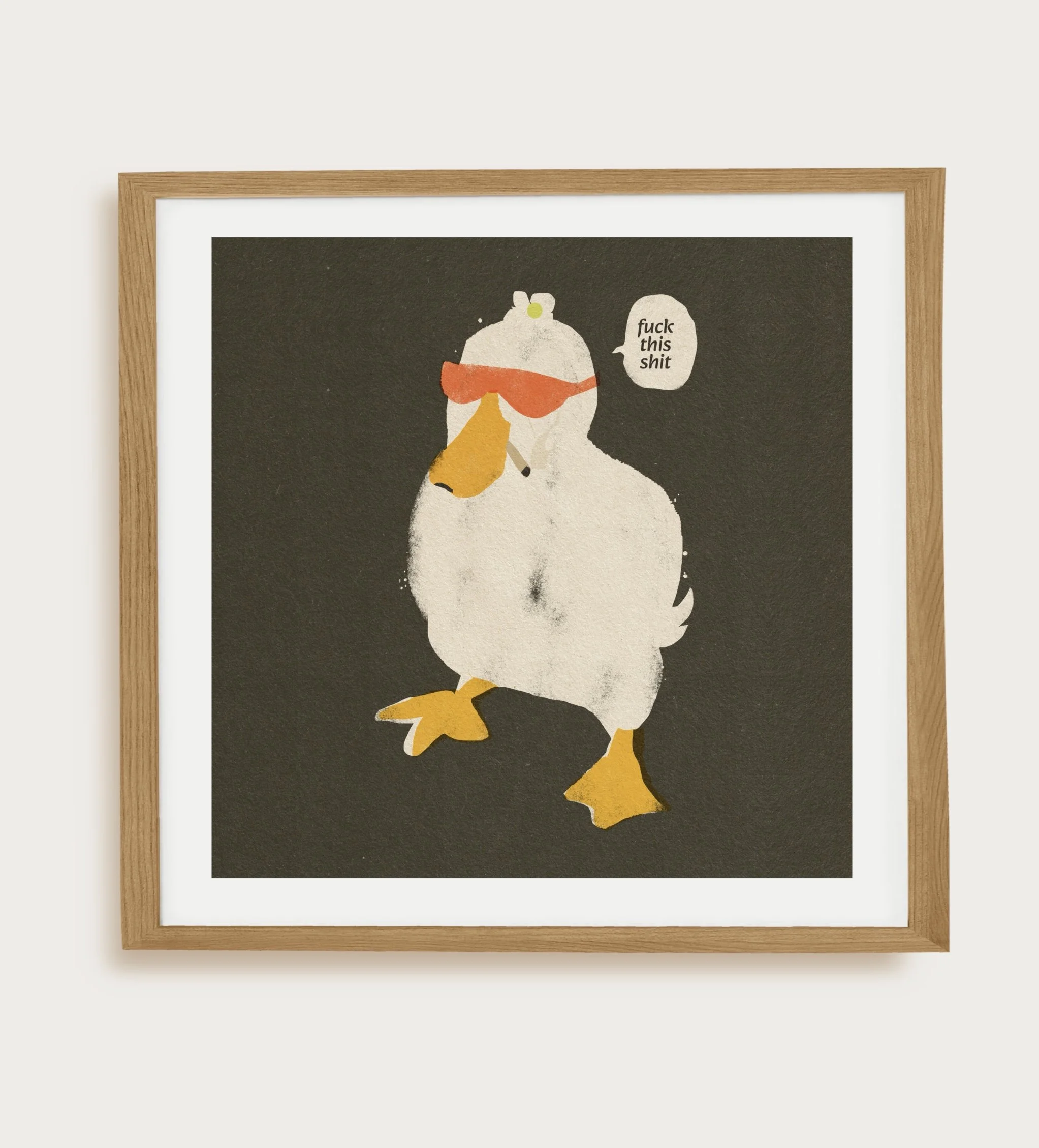 Framed square duck art print showing a white duck in sunglasses with a sarcastic speech bubble, displayed in a natural wood frame with a white mat.