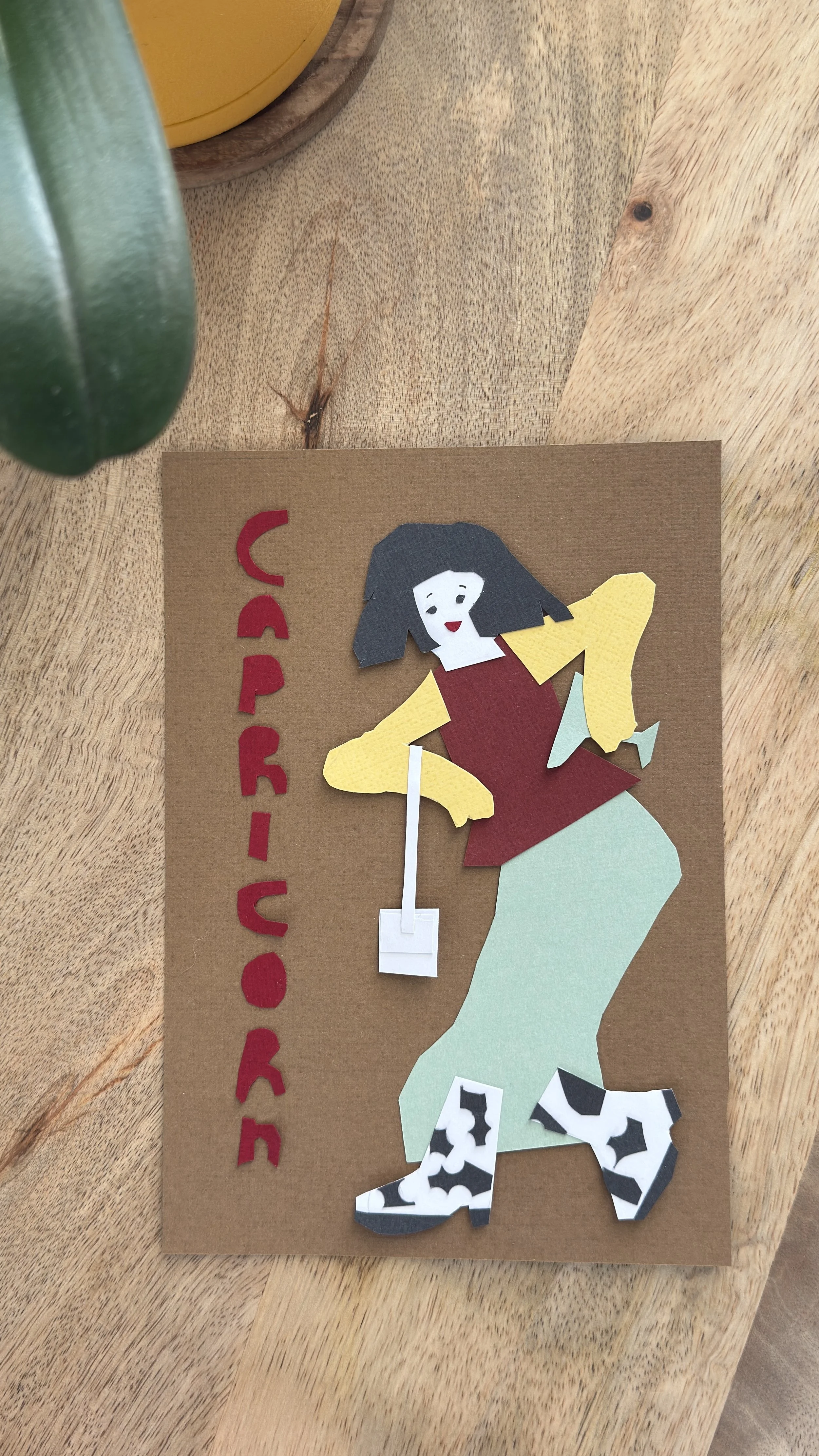 Detail of Capricorn paper collage showing layered hand-cut paper