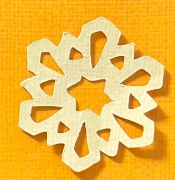 Hand-cut paper collage artwork by contemporary paper artist, featuring minimalist compositions made from layered colored paper