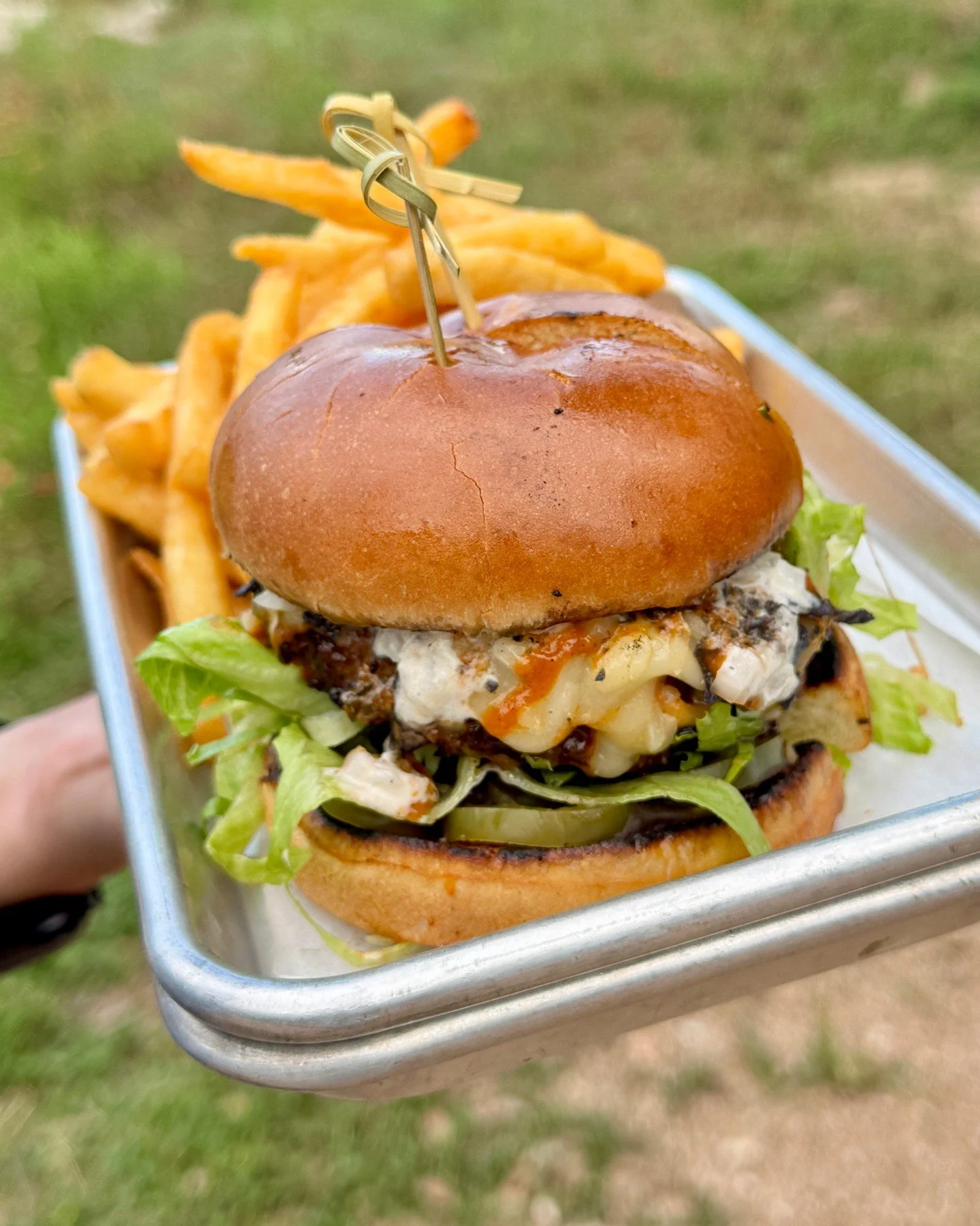 June Burger of the Month: El Chingon

Flame-grilled Wagyu beef with enchilada sauce, jalapeno, white onion, tortilla chips, oaxaca cheese, chihuahua cheese, Black Bean puree on a brioche bun. 

Also --> Find this burger next Saturday at the @austi