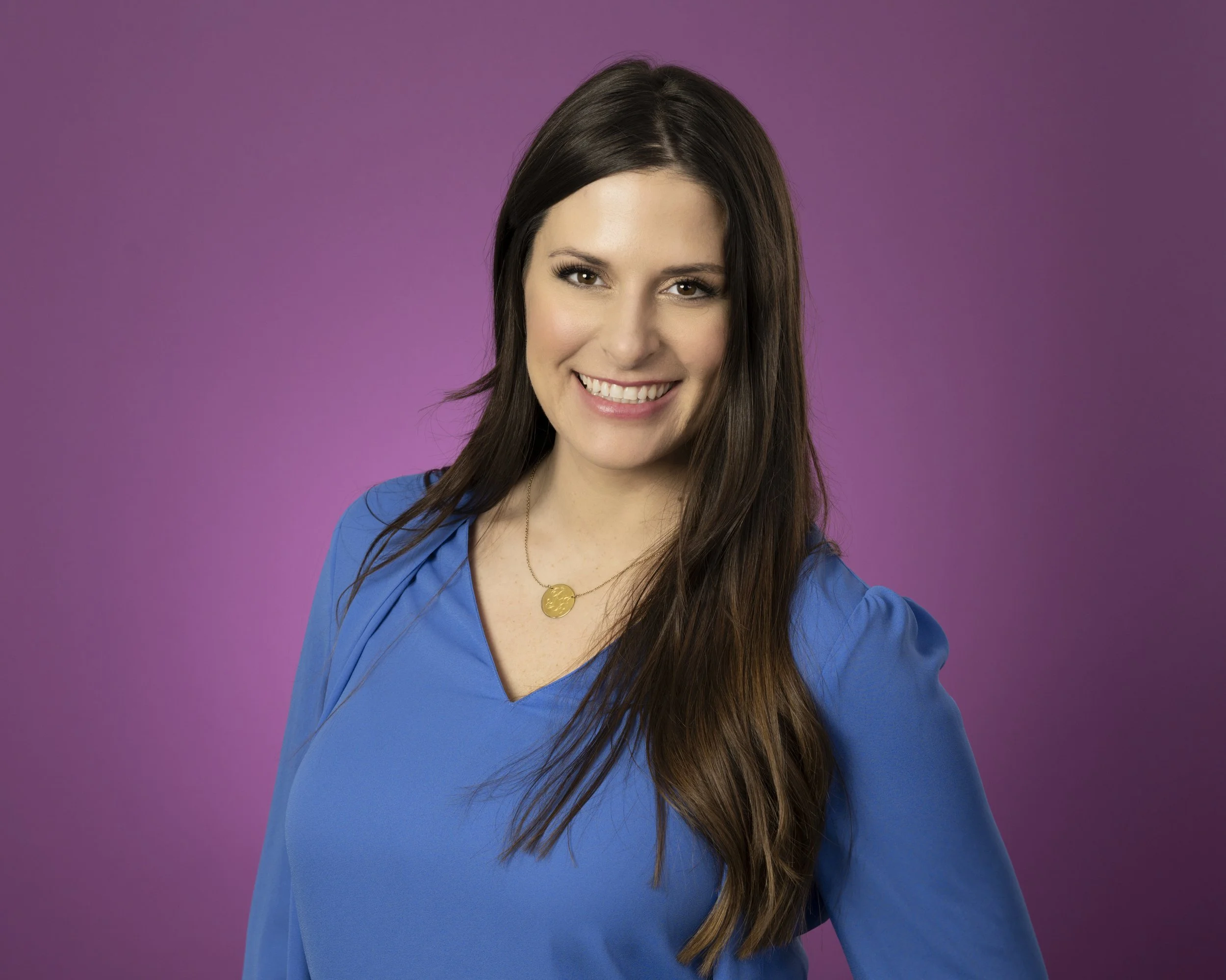 professional headshot against a purple backdrop