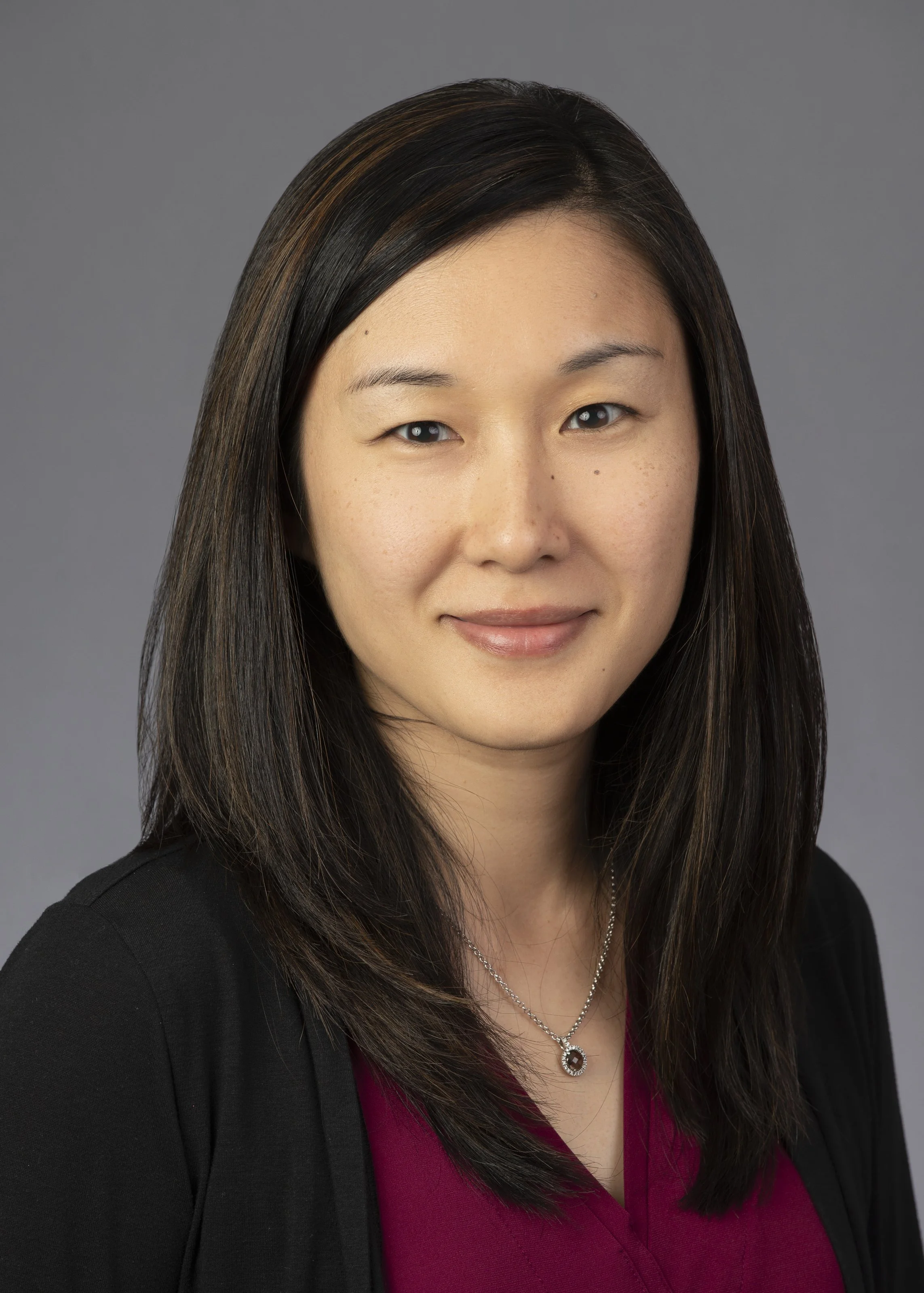 Professional headshots of a woman in Itasca at an accounting firm by a photographer based in Chicago.