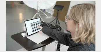 Woman recording with a tablet in a recording studio