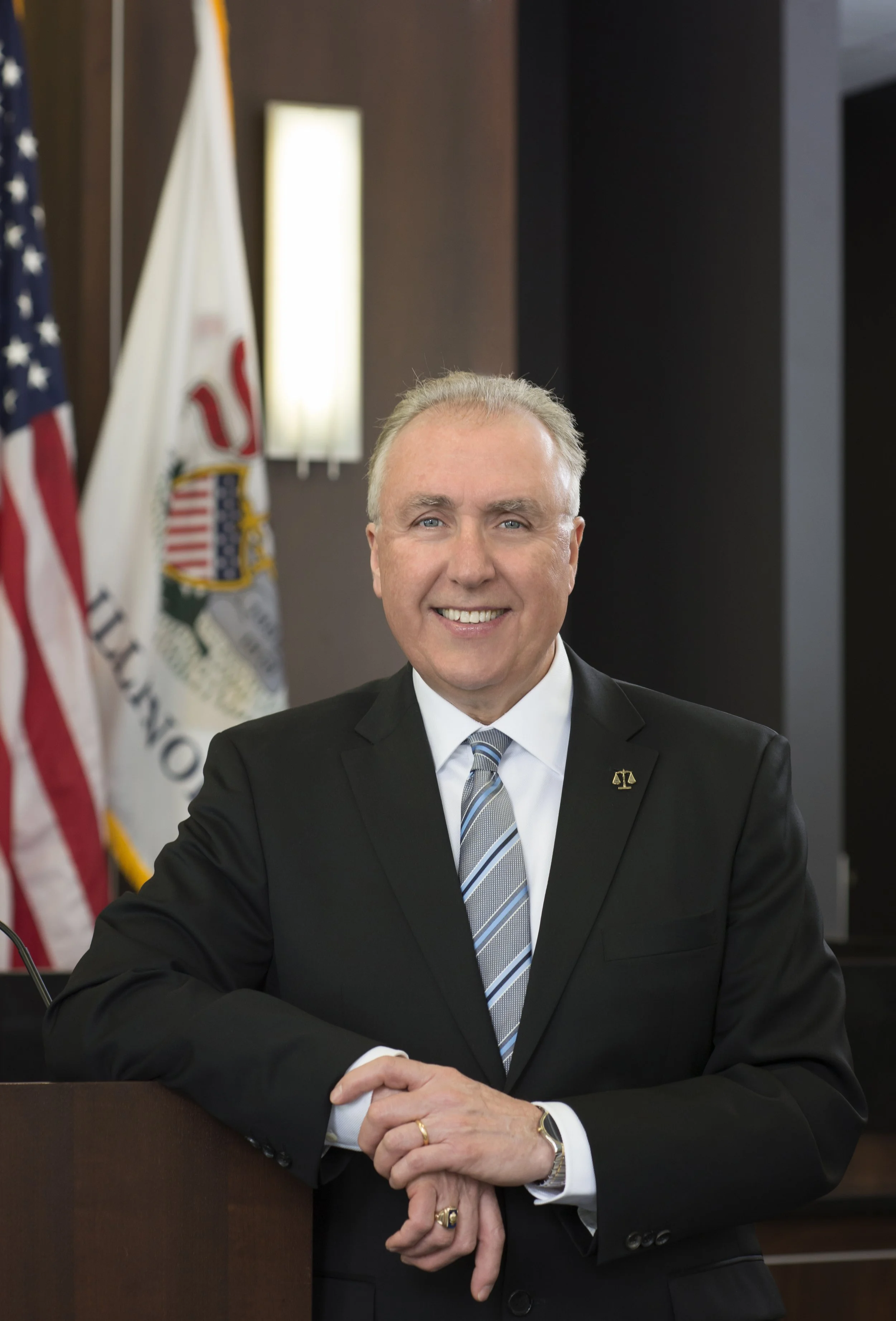 Chicago business portrait taken for a magazine story in the Illinois Bar Journal of the president of the bar in front of a flag taken by one of the best photographers in the city