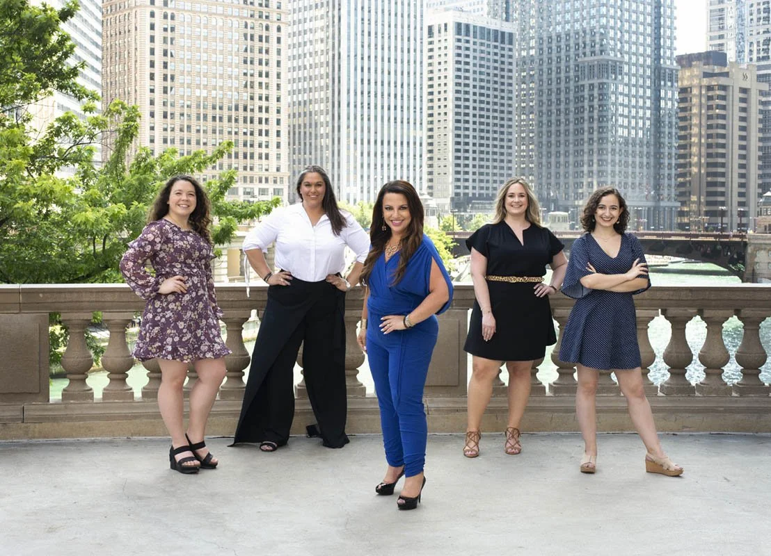 Group photo of professional business women with Chicago skyline