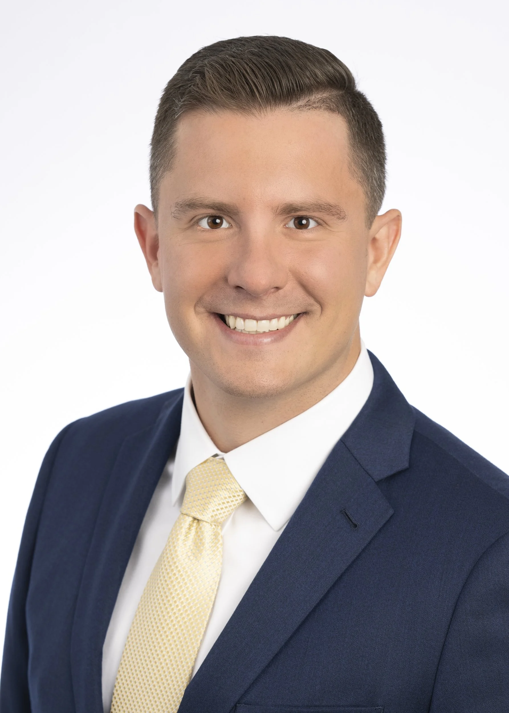 Chicago head shot photography of a business man on a white backdrop.  Photos by a top Chicago headshot photographer with premium lighting and camera equipment.