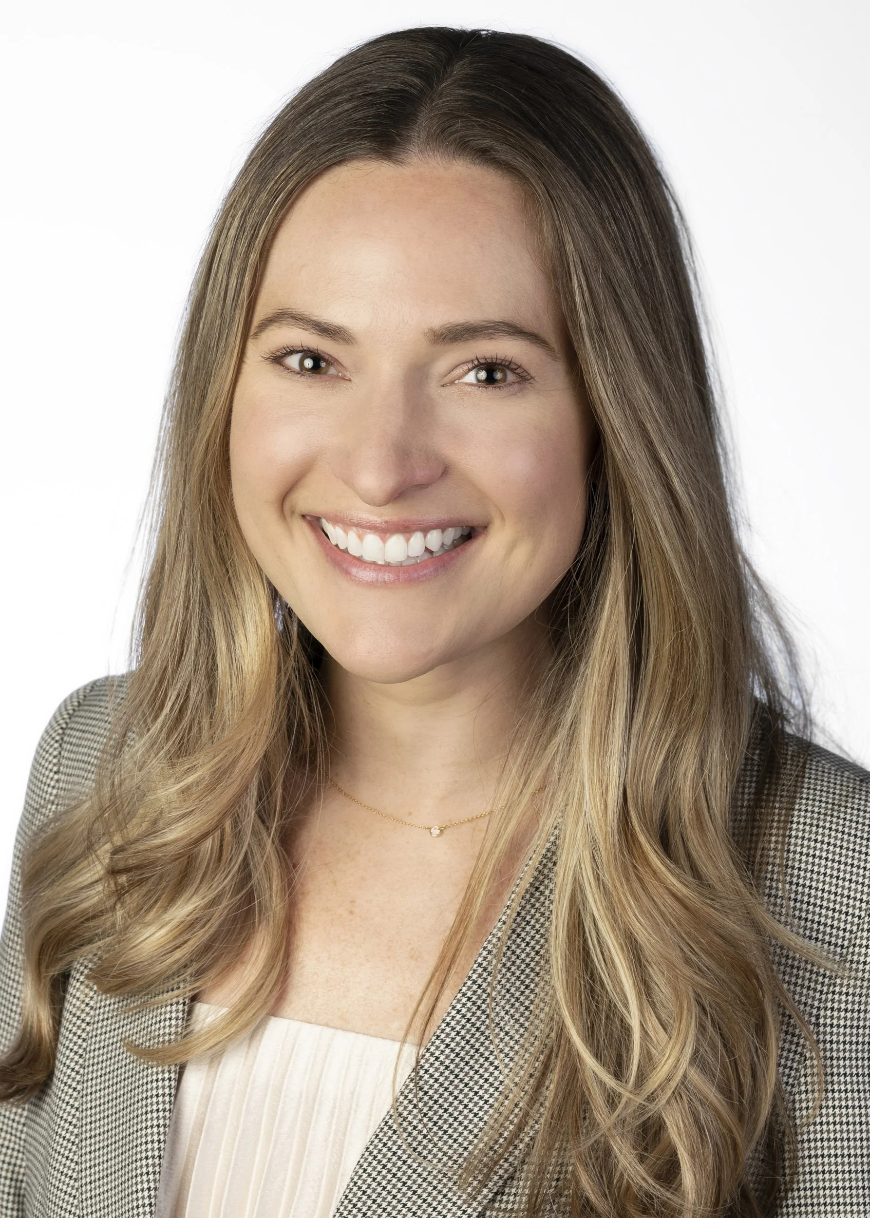 Staff headshot in Chicago of a woman on a solid white background by a top photographer.