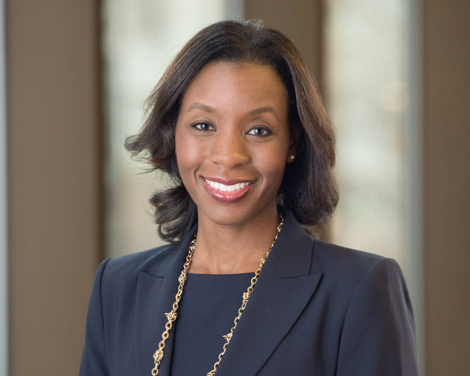 Professional business headshot in Chicago taken by a top photographer with the background in soft focus 